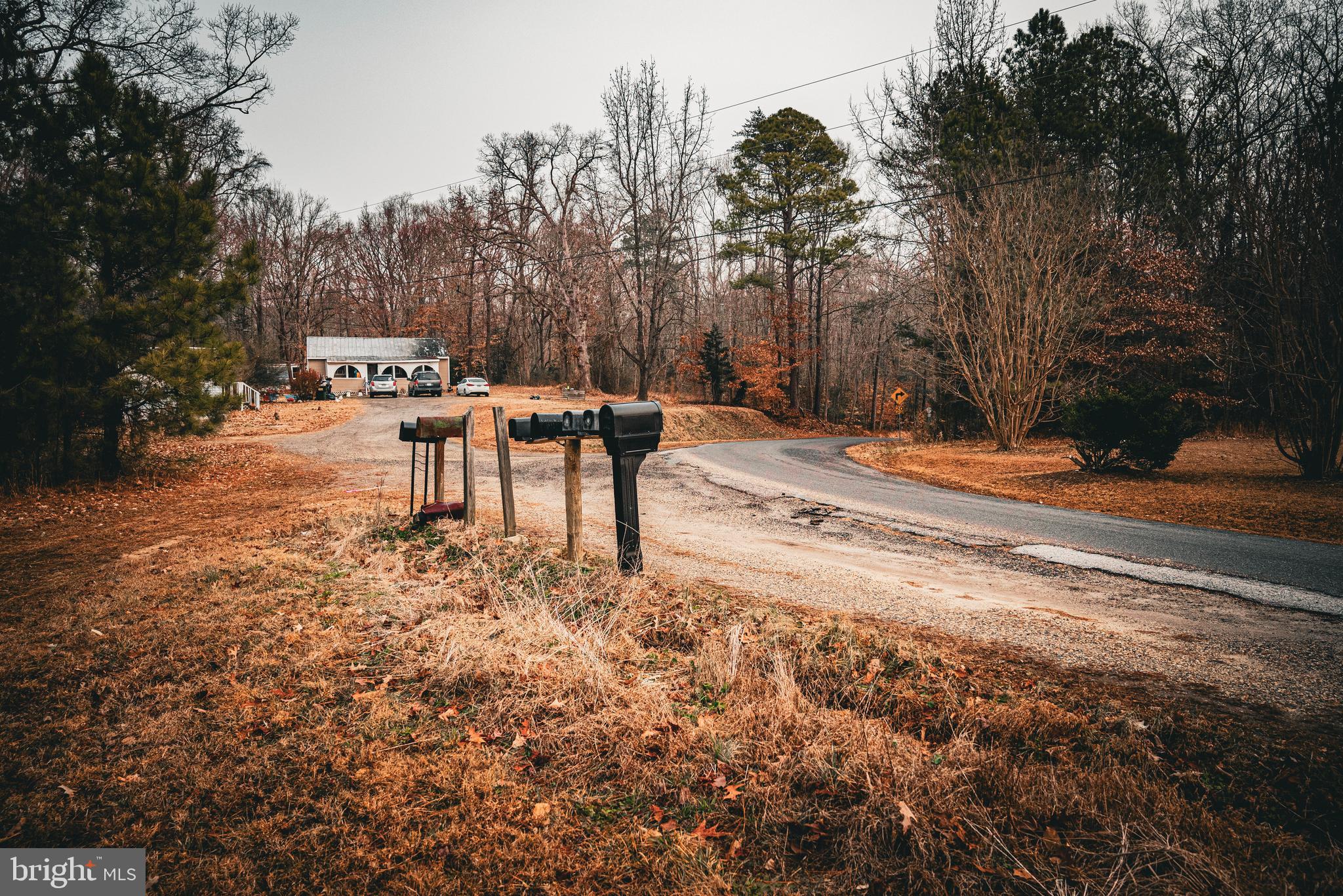 Tbd Parrish Lane Colonial Beach, VA 22443 - Photo 7 of 18 a backyard of a house with table and chairs