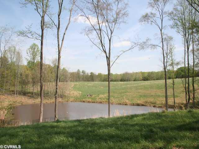 4 Perkins Road Cartersville, VA 23027 - Photo 1 of 6 Land - This property is one of the finest building sites in all of White Level Farms. It has an old homestie of Old Growth trees overlooking "Perkins Pond"