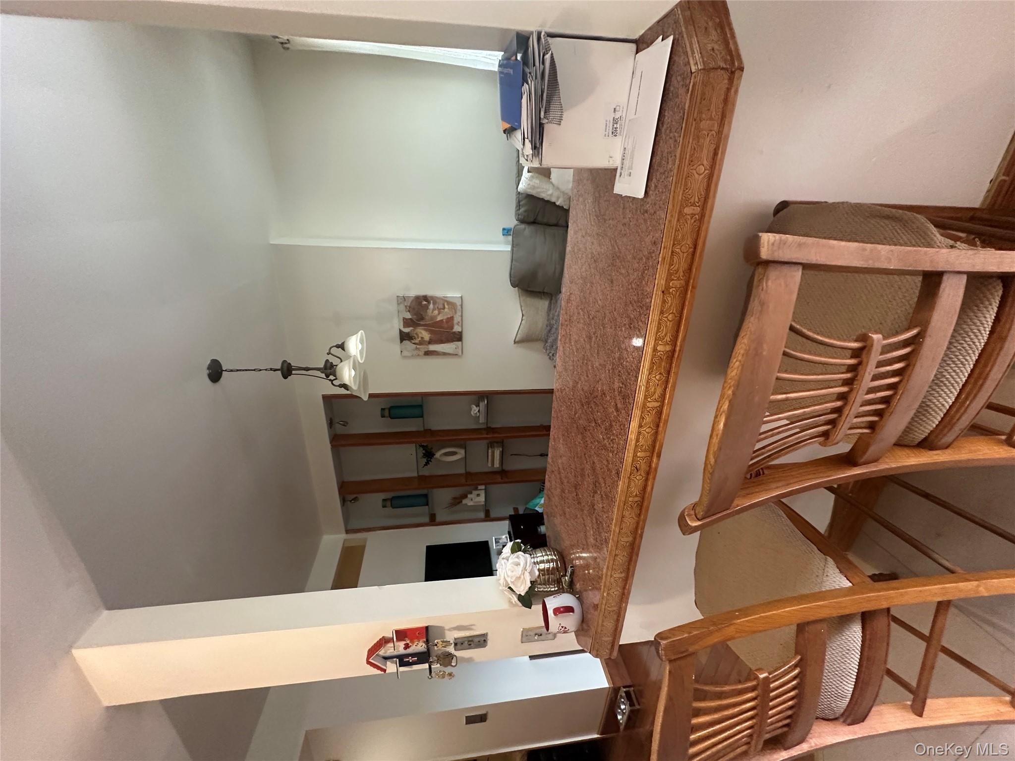 1245 Madison Street Brooklyn, NY 11221 - Photo 11 of 15 a view of a dining room with furniture and a chandelier