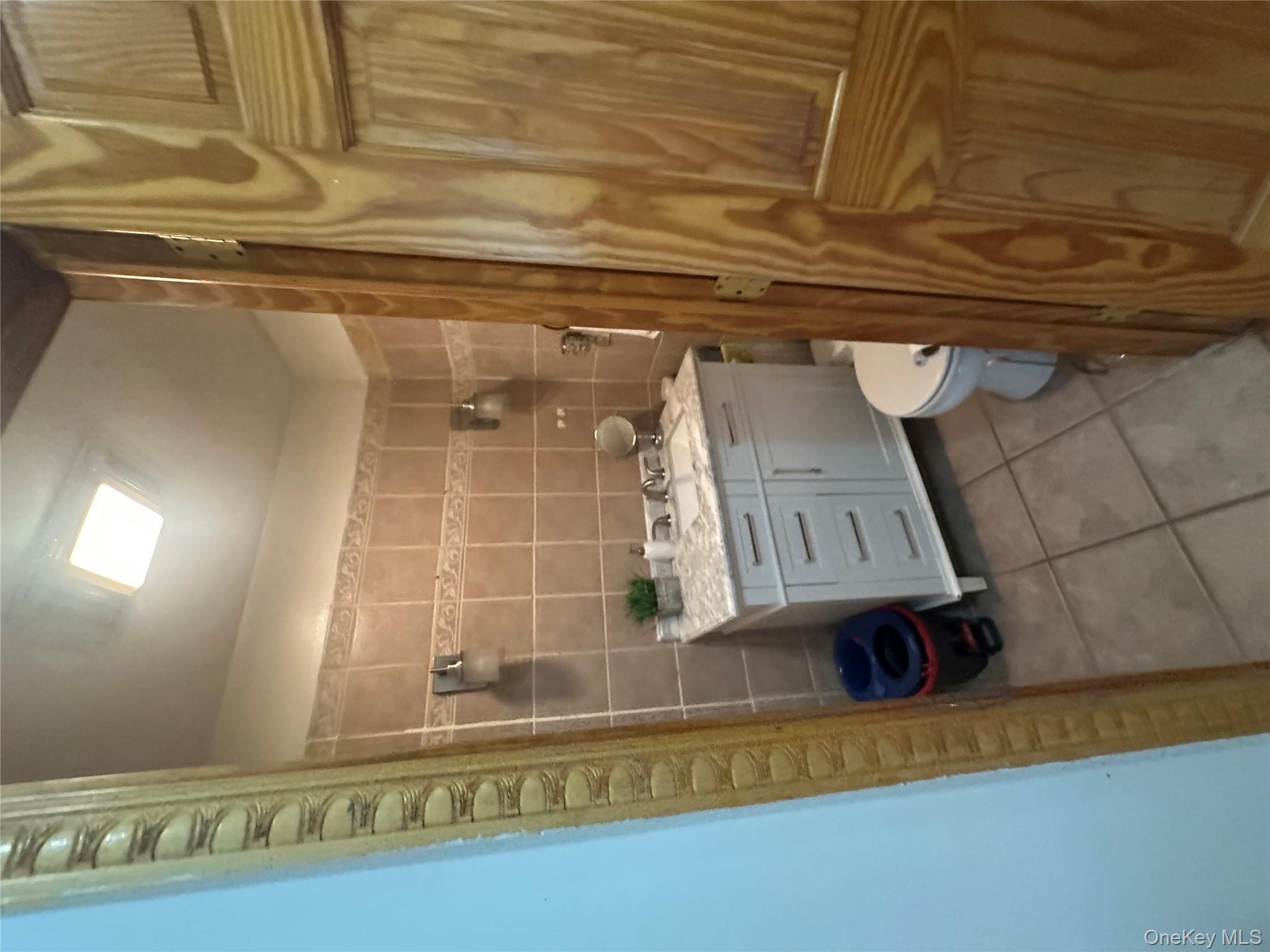 1245 Madison Street Brooklyn, NY 11221 - Photo 12 of 15 a bathroom with a sink toilet and shower