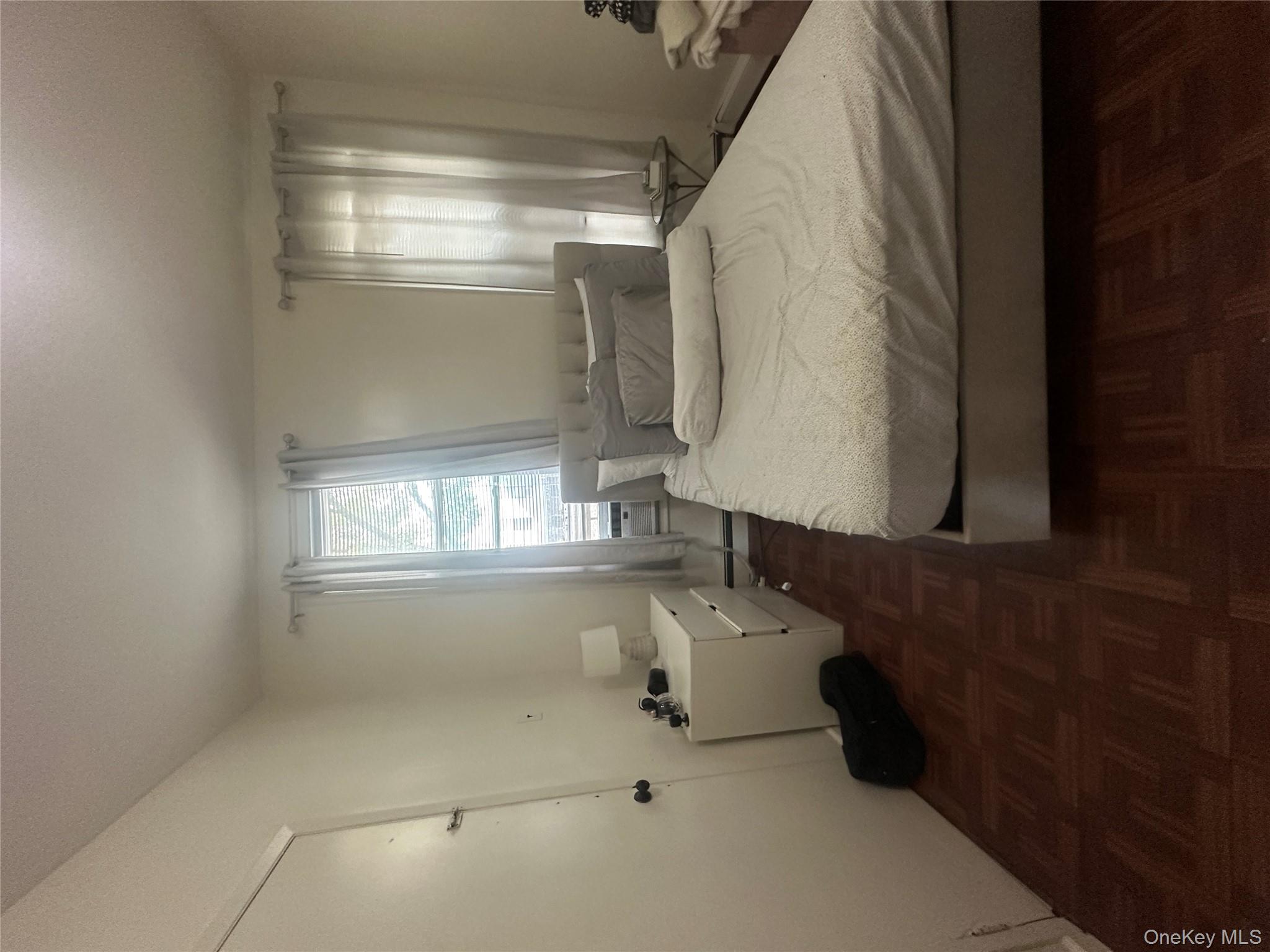 1245 Madison Street Brooklyn, NY 11221 - Photo 3 of 15 a bedroom with a bed and window