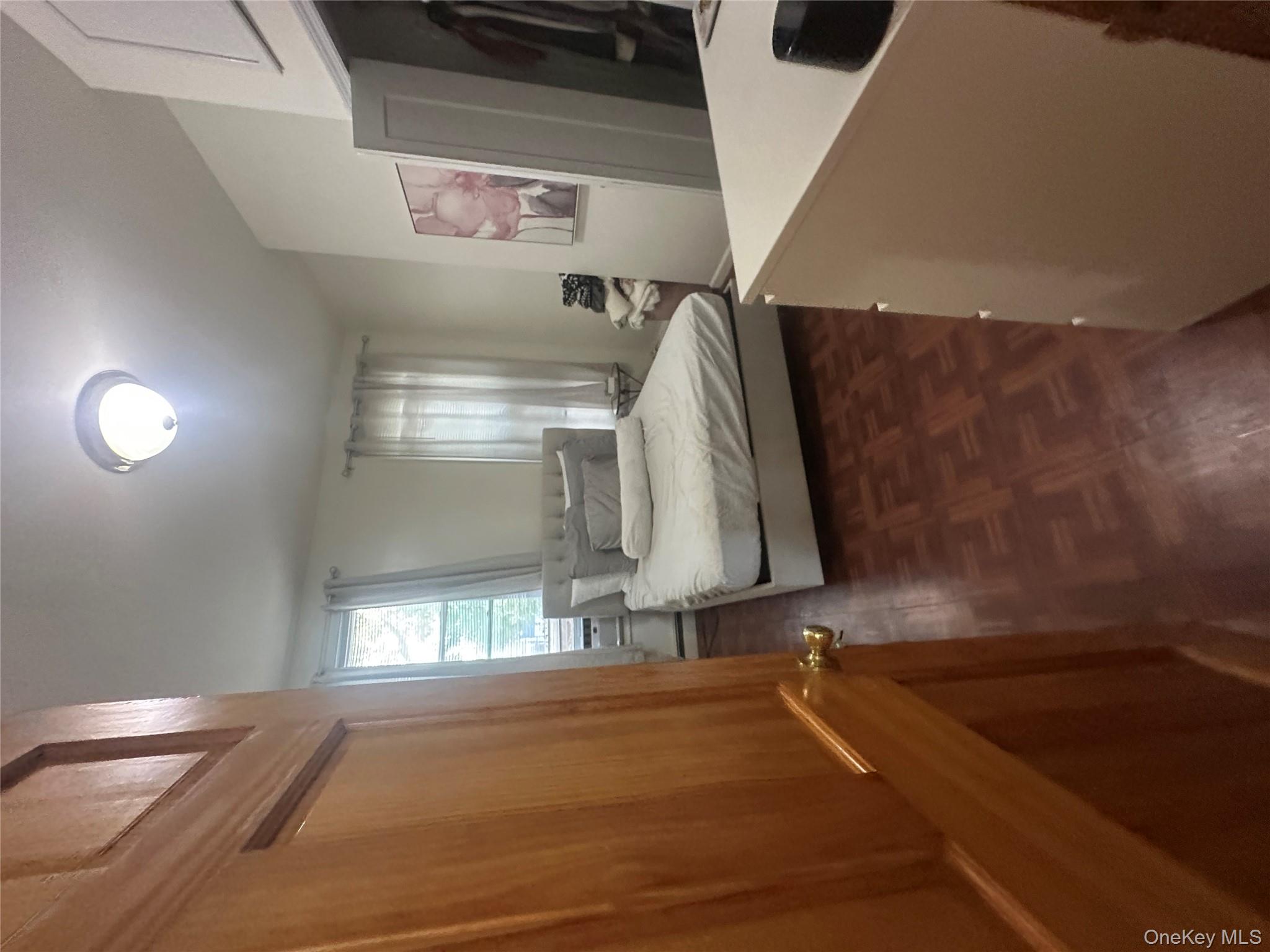 1245 Madison Street Brooklyn, NY 11221 - Photo 4 of 15 a living room with stainless steel appliances wooden floor and large window
