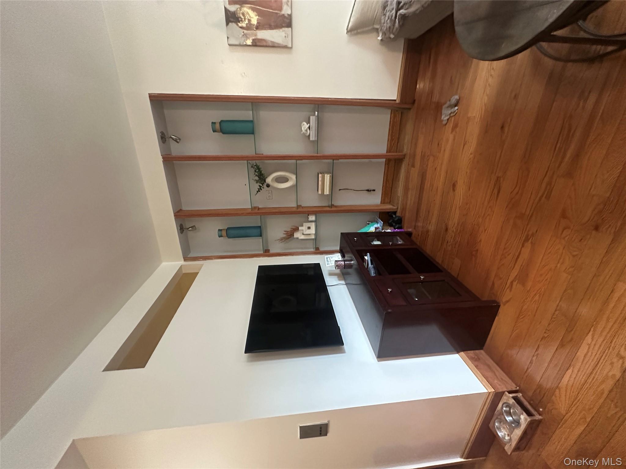 1245 Madison Street Brooklyn, NY 11221 - Photo 6 of 15 a living room with flat screen tv and furniture