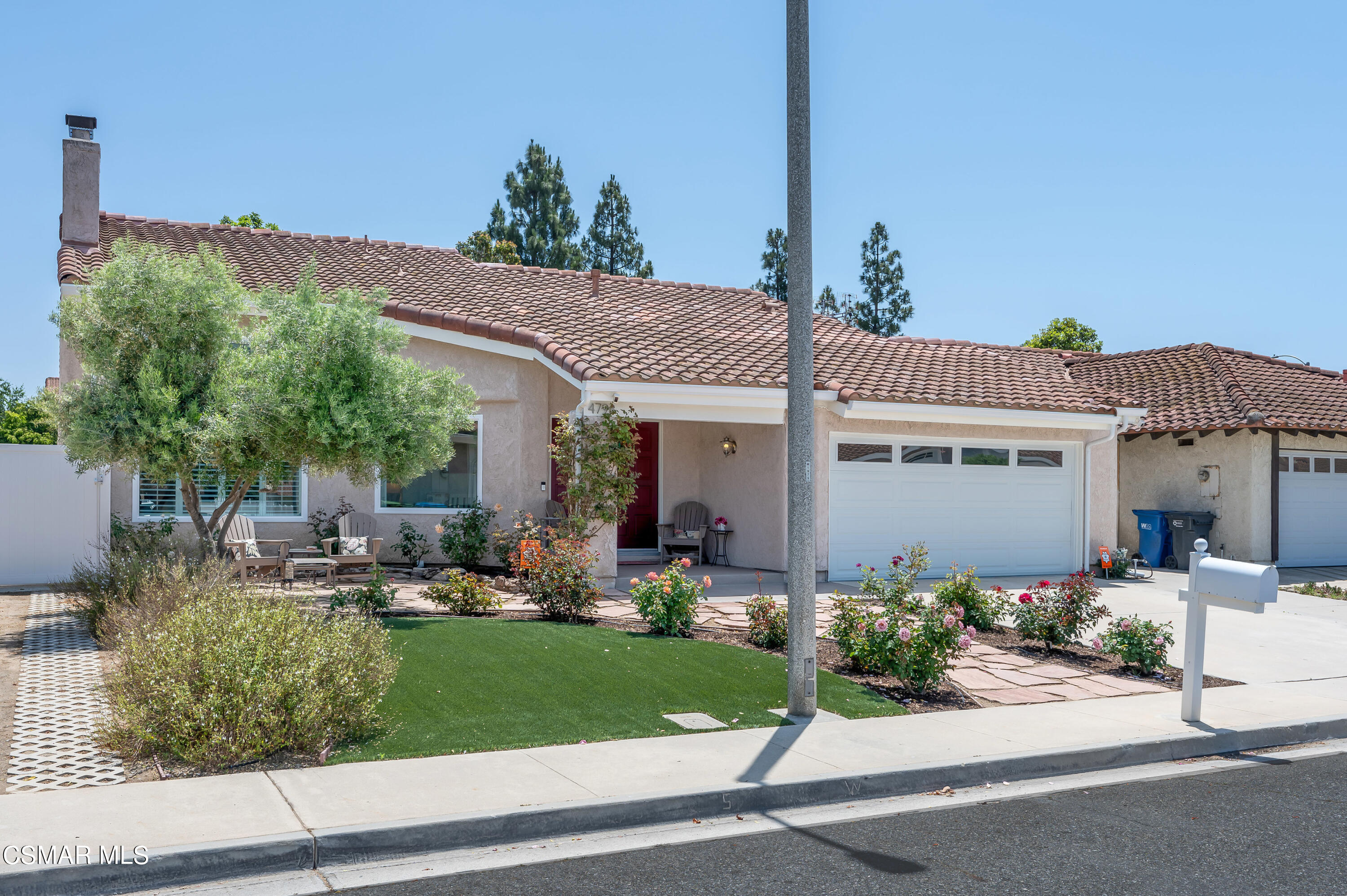 4798 Talmadge Road Moorpark, CA 93021 - Photo 2 of 65 a front view of a house with a garden and plants