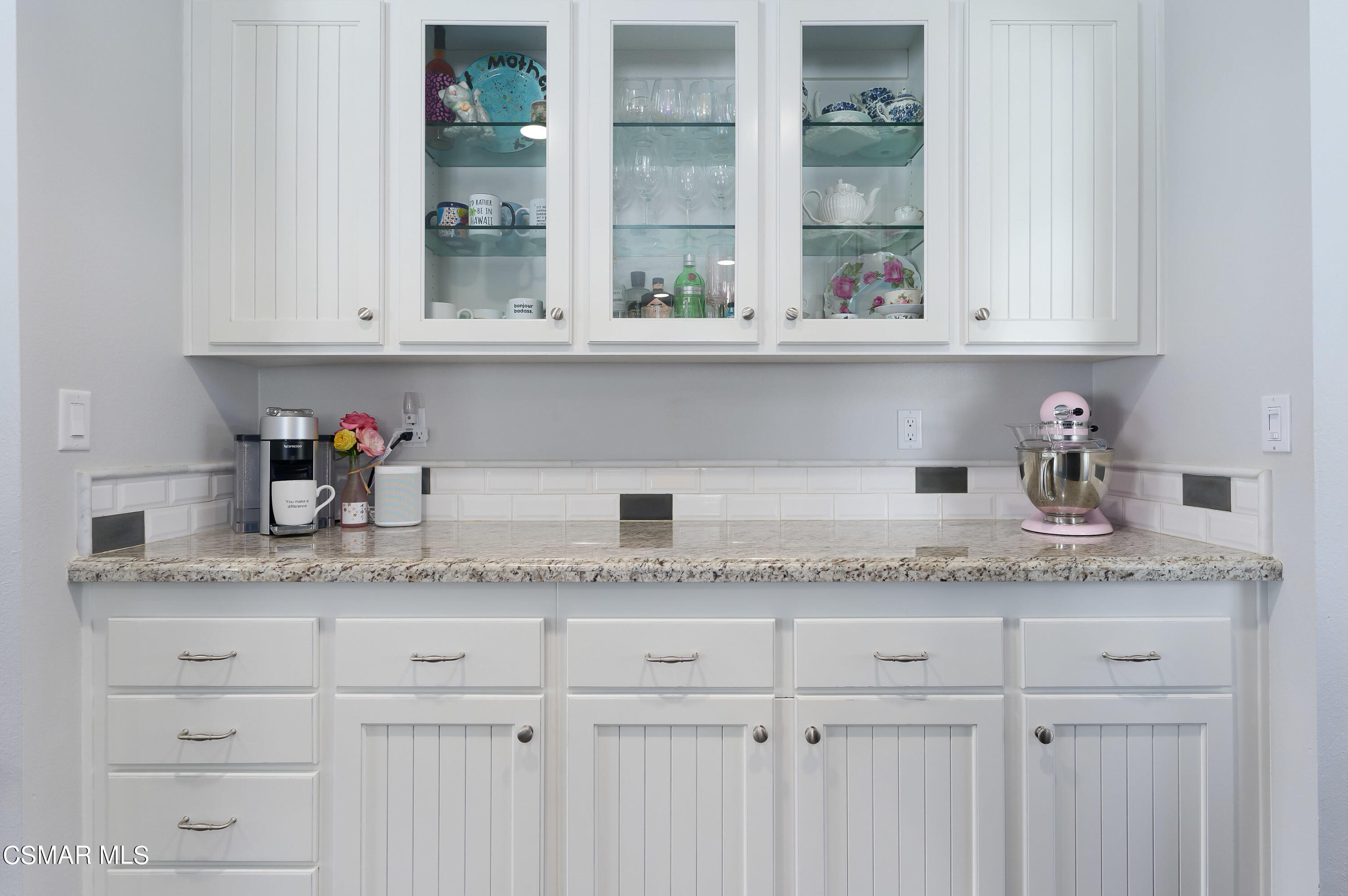 4798 Talmadge Road Moorpark, CA 93021 - Photo 21 of 65 a kitchen with granite countertop white cabinets and a window