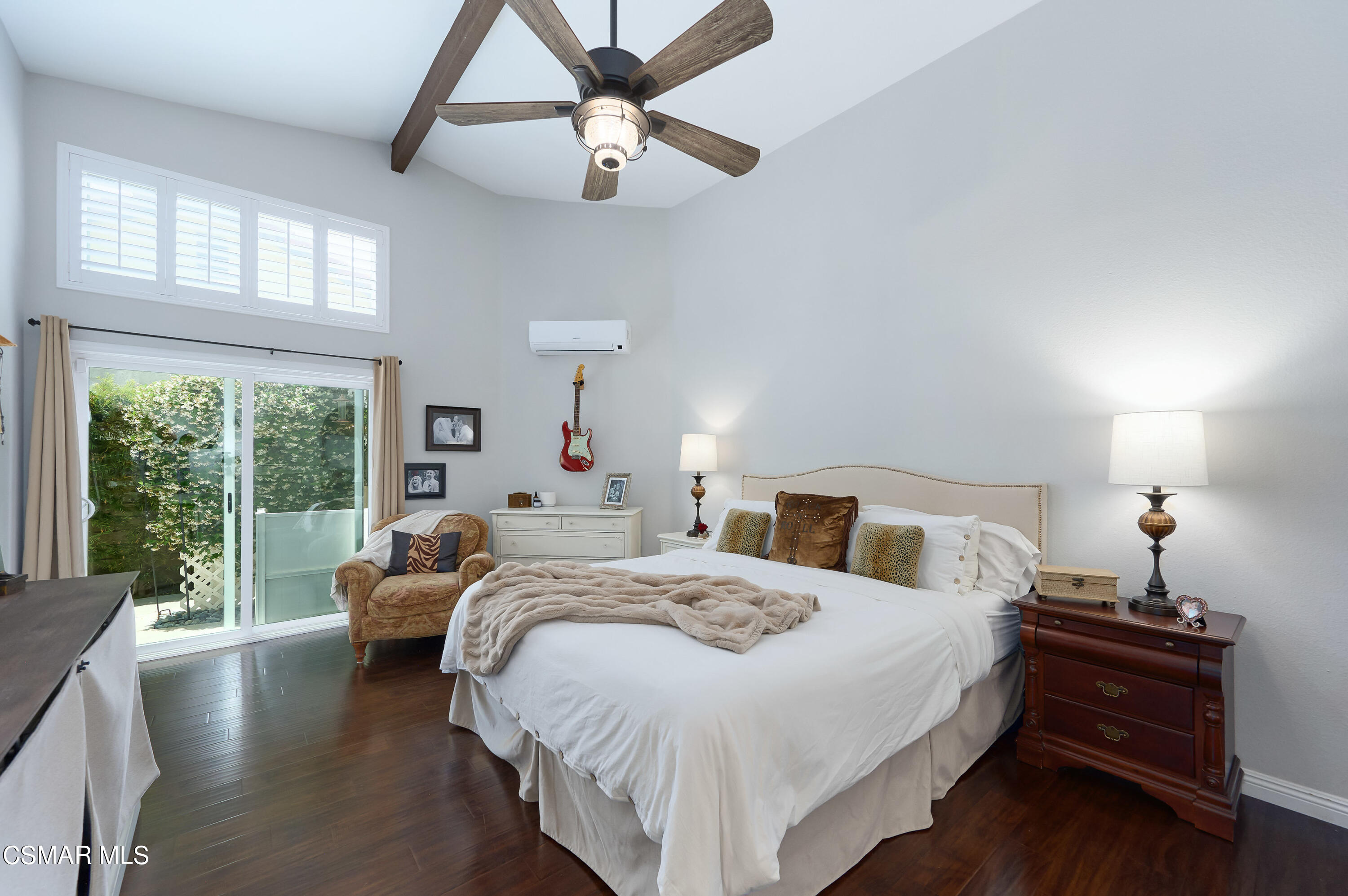 4798 Talmadge Road Moorpark, CA 93021 - Photo 27 of 65 a bedroom with a large bed and a chandelier