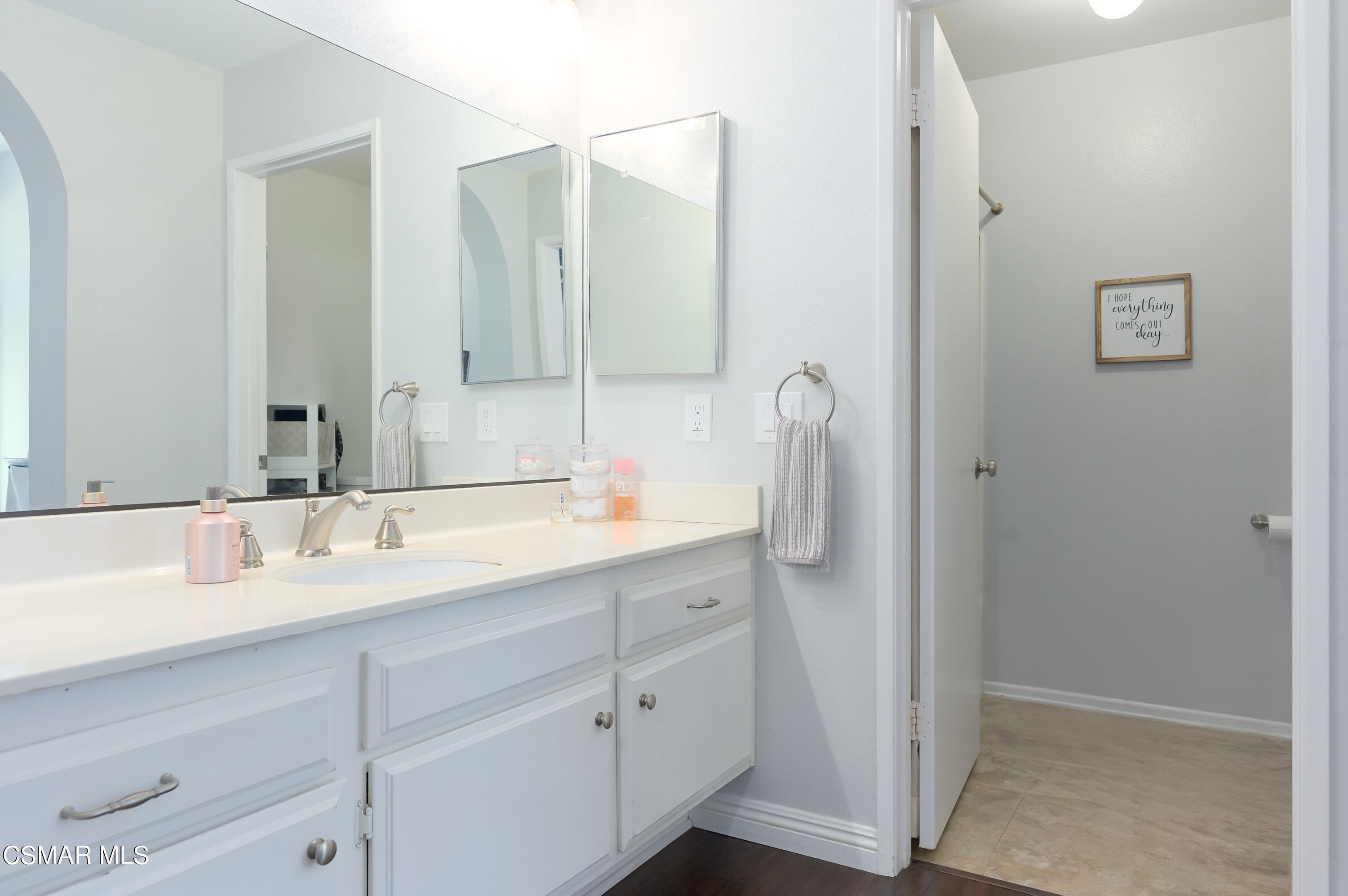 4798 Talmadge Road Moorpark, CA 93021 - Photo 34 of 65 a bathroom with a double vanity sink and mirror