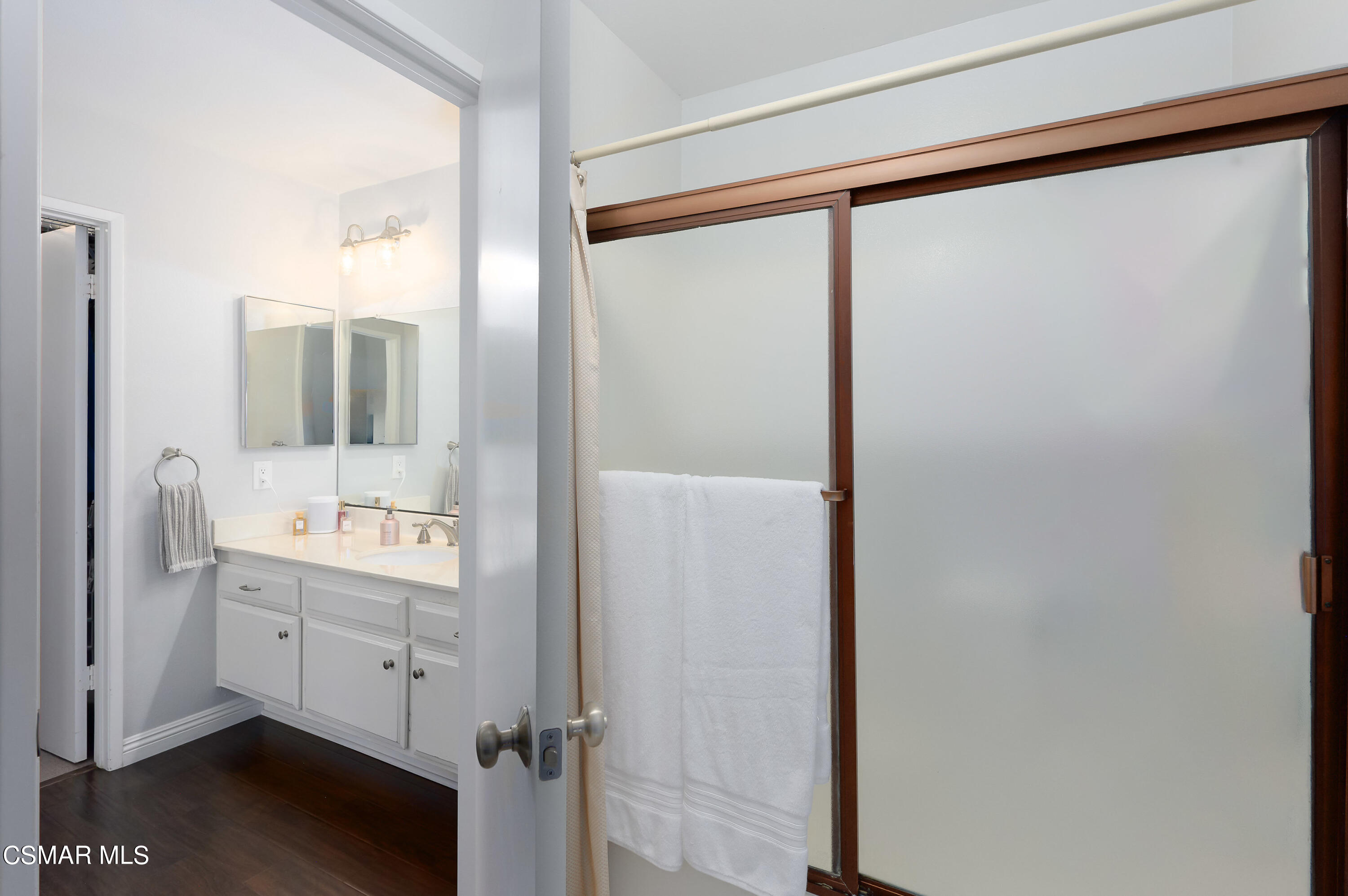4798 Talmadge Road Moorpark, CA 93021 - Photo 35 of 65 a bathroom with a double vanity sink and mirror