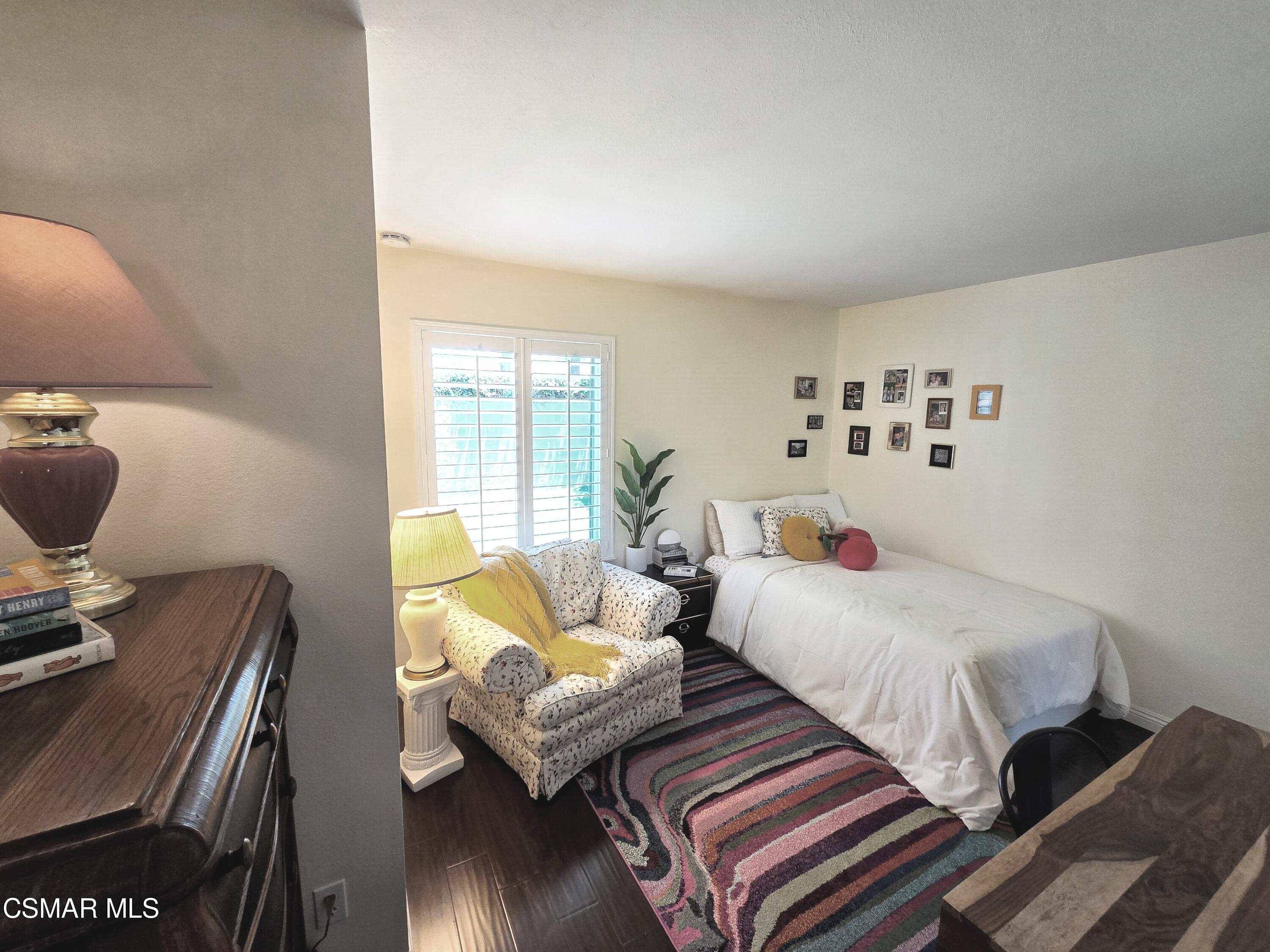 4798 Talmadge Road Moorpark, CA 93021 - Photo 40 of 65 a bedroom with a bed and wooden floor