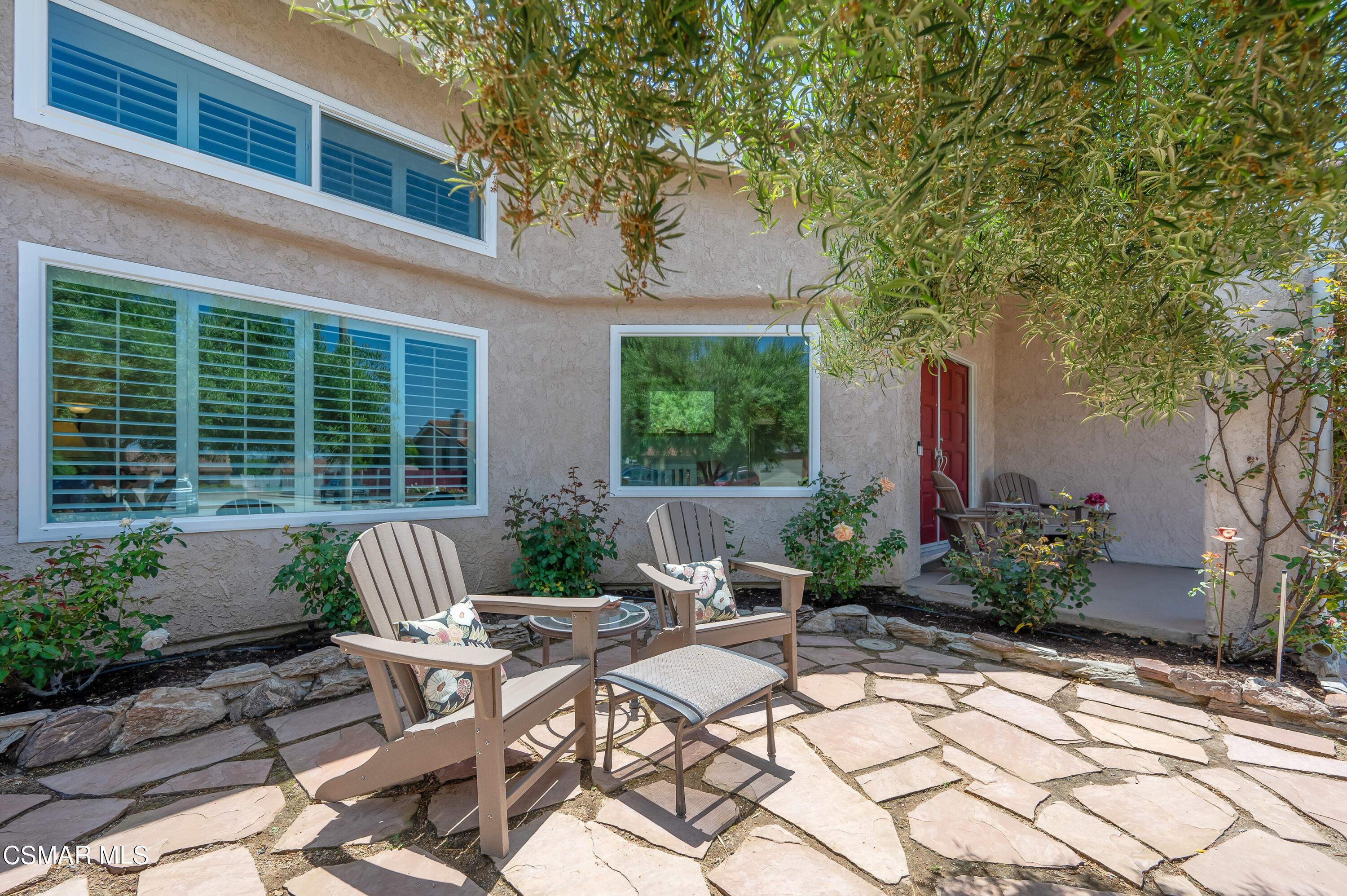 4798 Talmadge Road Moorpark, CA 93021 - Photo 4 of 65 a view of a patio with couches table and chairs and potted plants