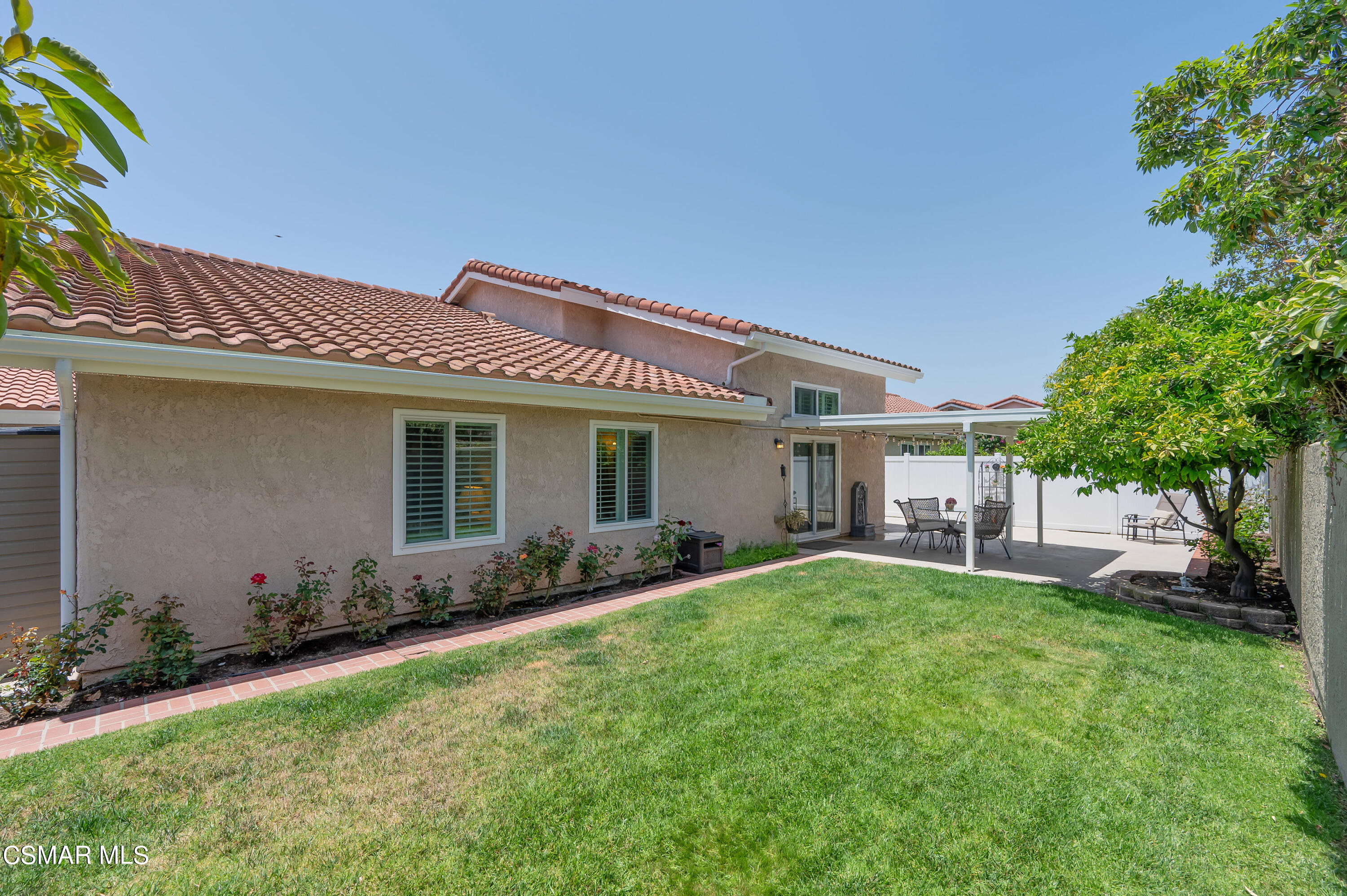 4798 Talmadge Road Moorpark, CA 93021 - Photo 60 of 65 a front view of a house with a garden and plants