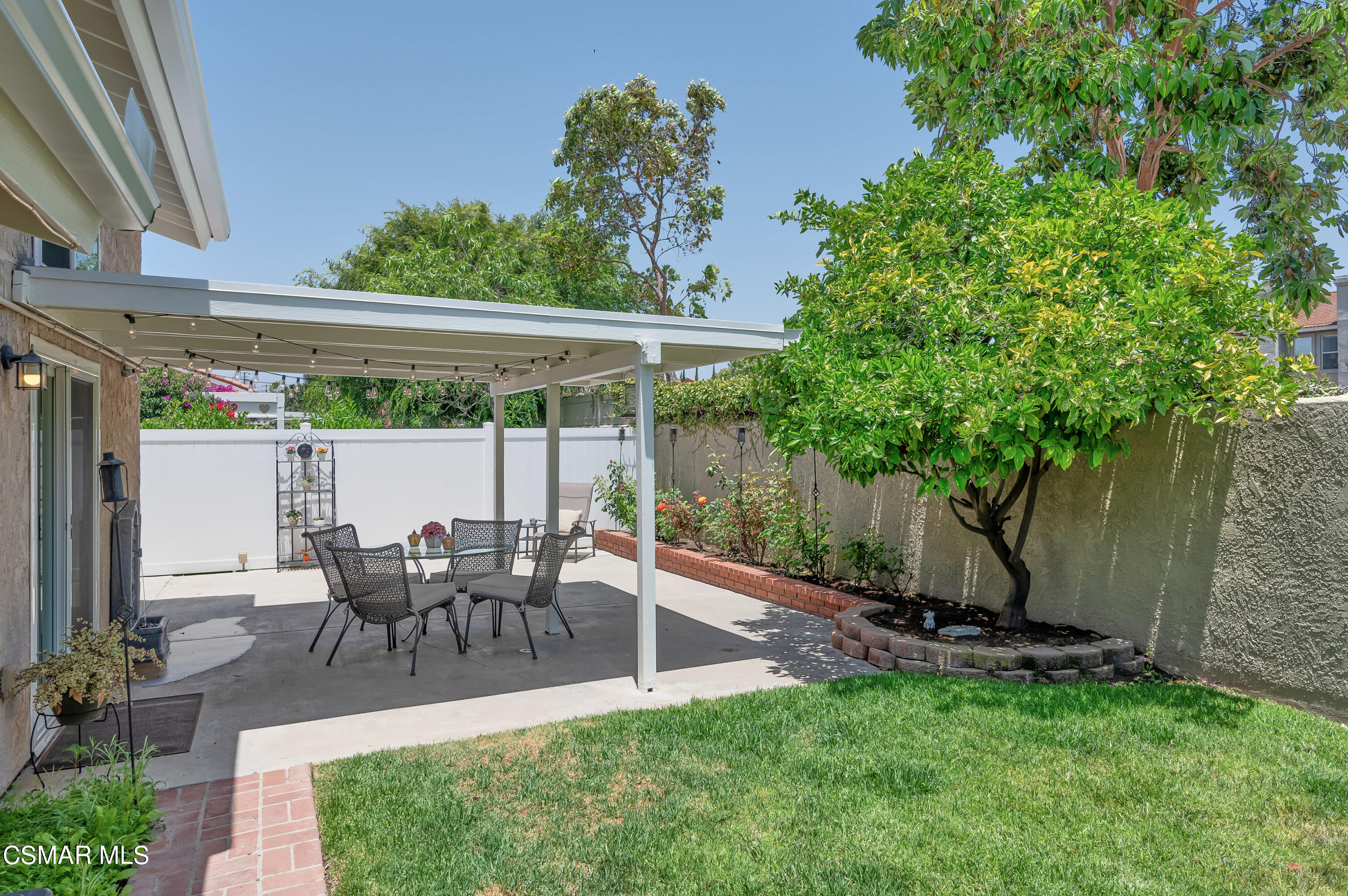 4798 Talmadge Road Moorpark, CA 93021 - Photo 63 of 65 a view of a patio with table and chairs potted plants and floor to ceiling window and potted plants