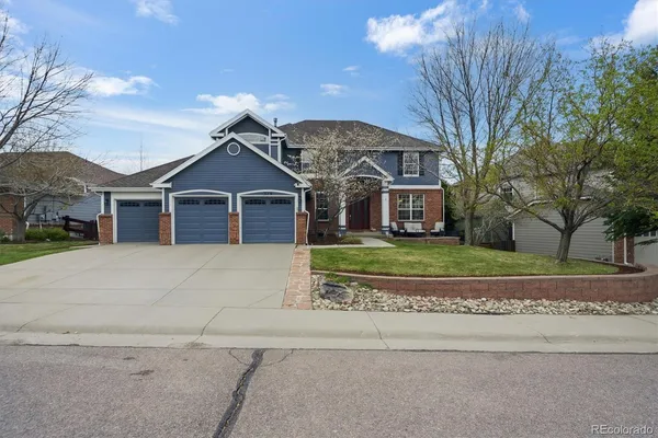 front view of a house with a small yard