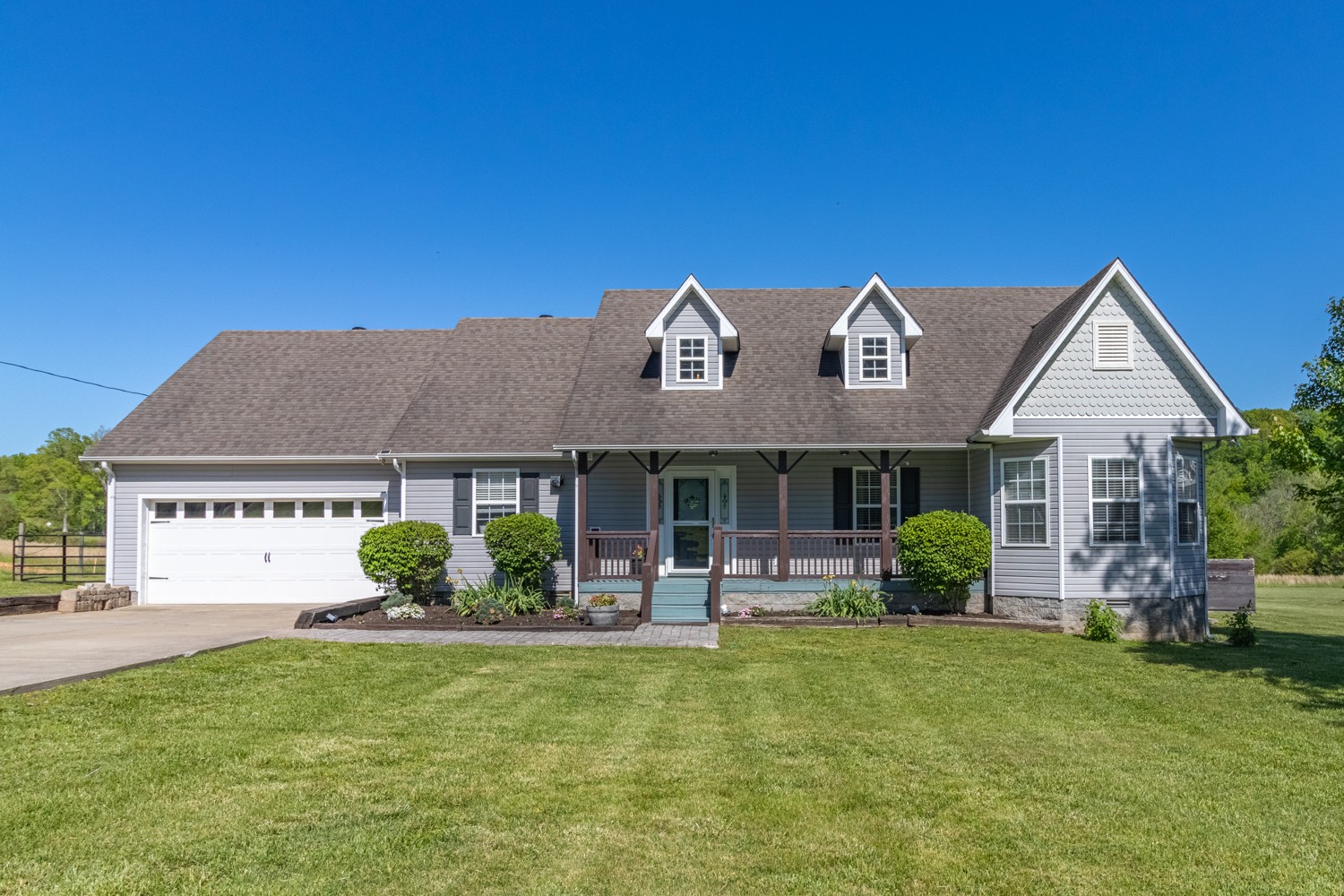 884 Tidwell Road Burns, TN 37029 - Photo 1 of 28 front view of a house with a yard