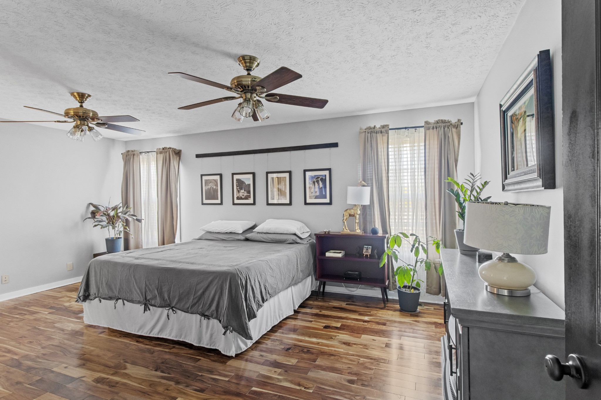 884 Tidwell Road Burns, TN 37029 - Photo 17 of 28 a bedroom with a bed and a chandelier