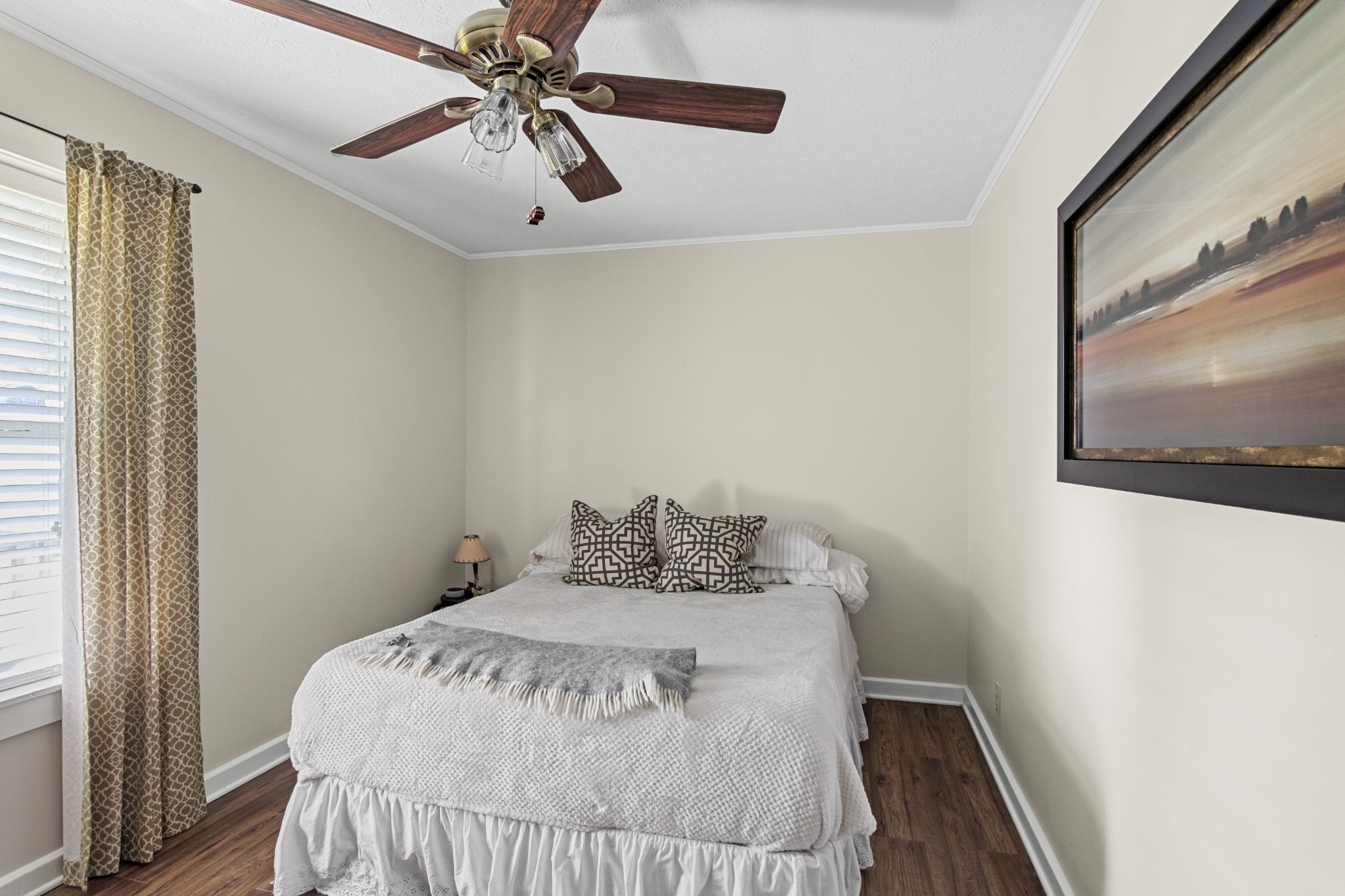 884 Tidwell Road Burns, TN 37029 - Photo 26 of 28 a bedroom with a bed and a chandelier
