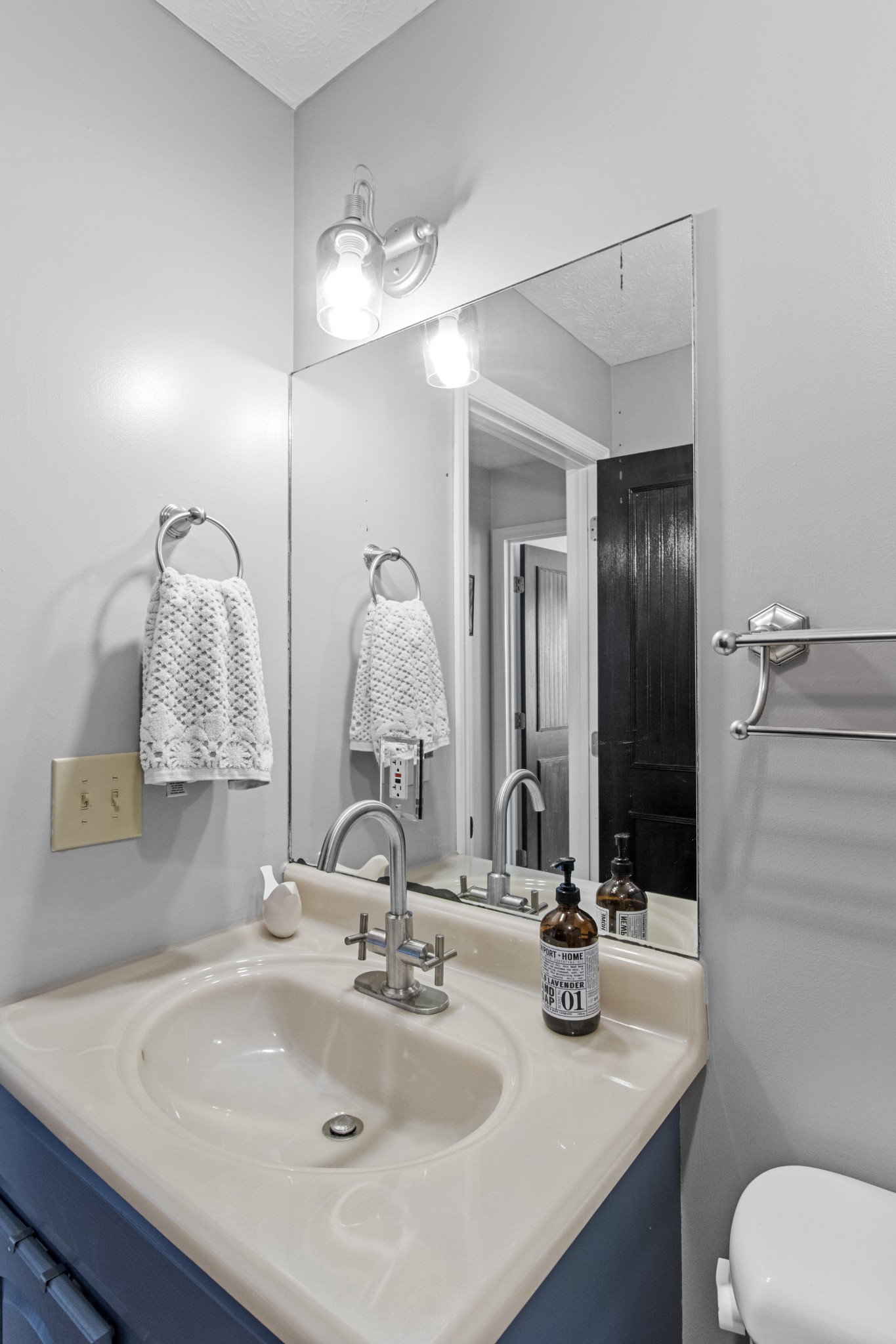884 Tidwell Road Burns, TN 37029 - Photo 28 of 28 a bathroom with a sink and a mirror