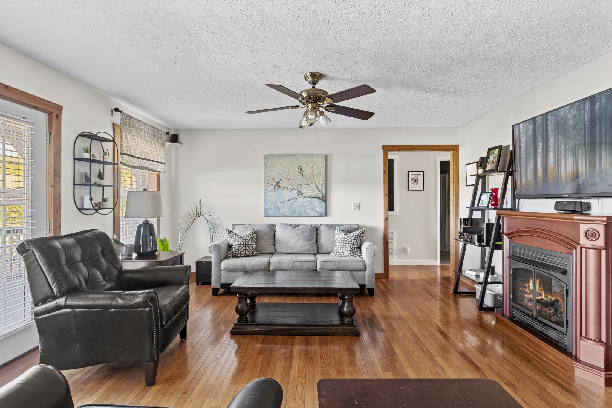 884 Tidwell Road Burns, TN 37029 - Photo 8 of 28 a living room with furniture and a fireplace