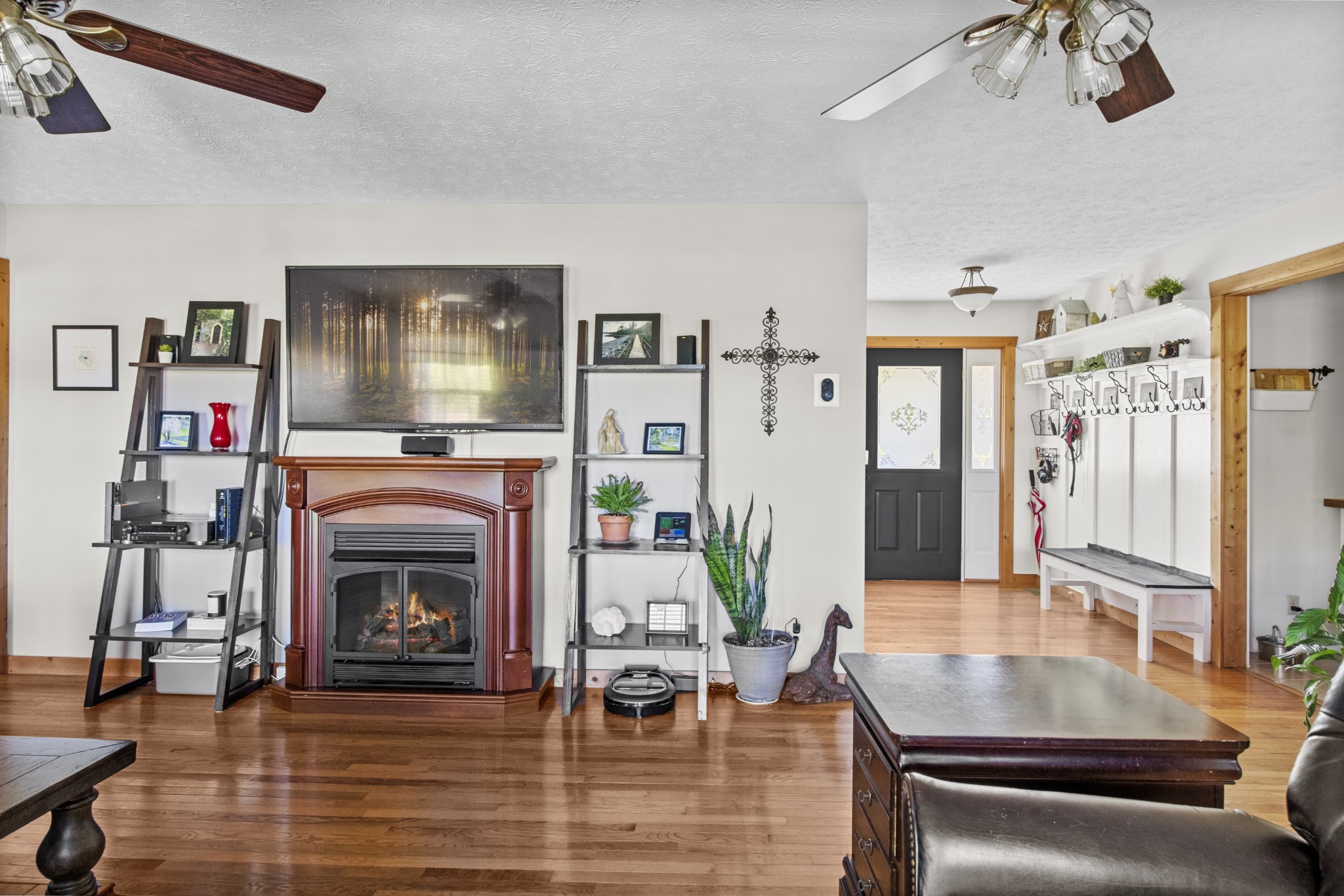 884 Tidwell Road Burns, TN 37029 - Photo 9 of 28 a living room with furniture and a fireplace