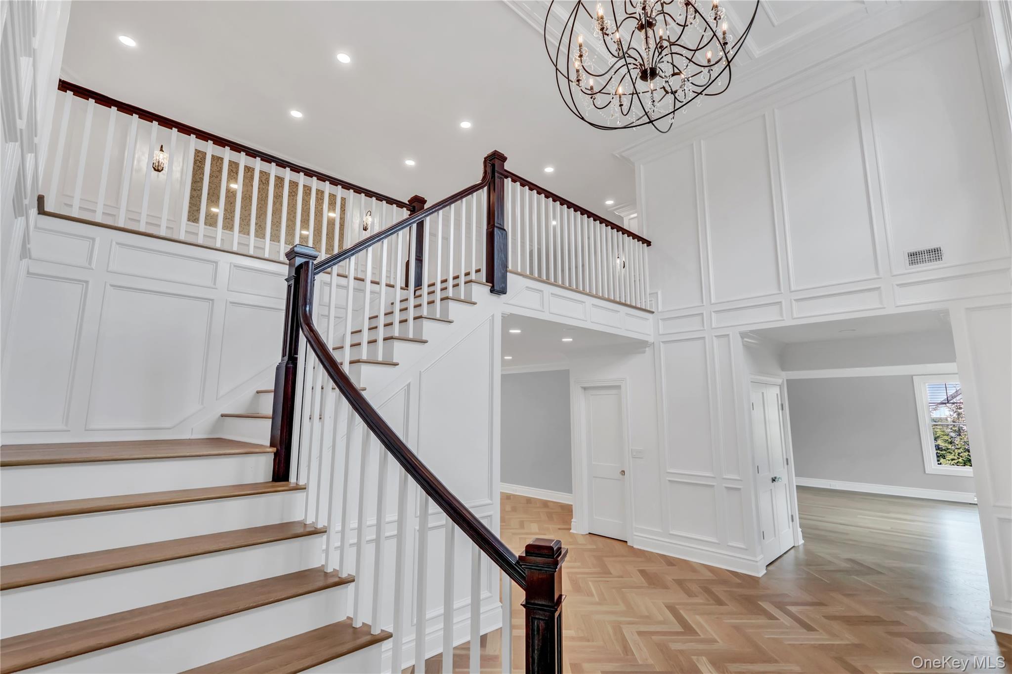 a view of entryway with wooden floor and stairs