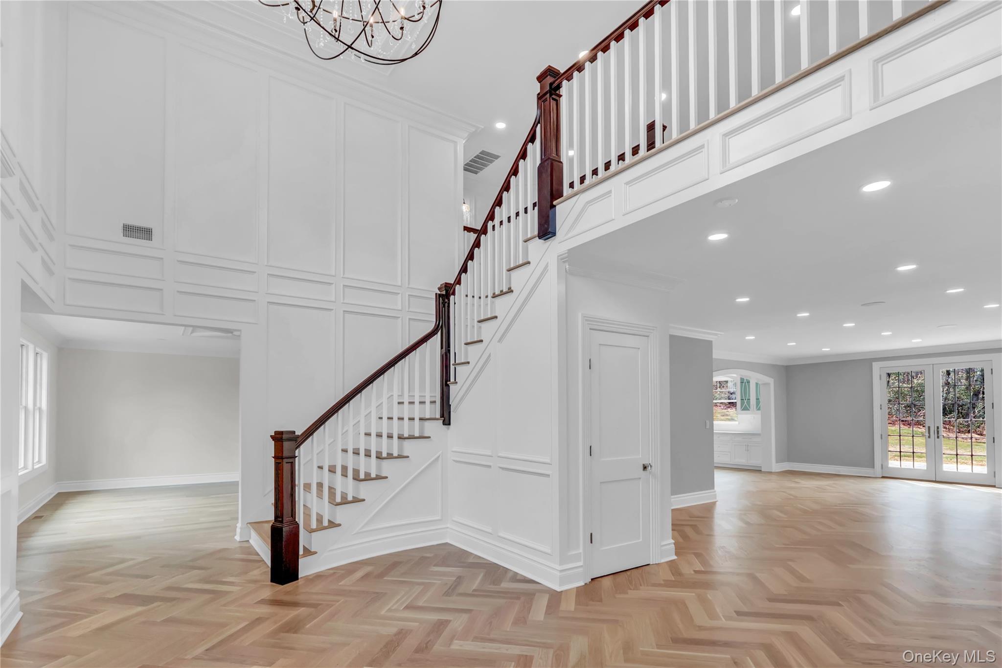 541 Split Rock Road Syosset, NY 11791 - Photo 11 of 50 a view of staircase with white walls and windows