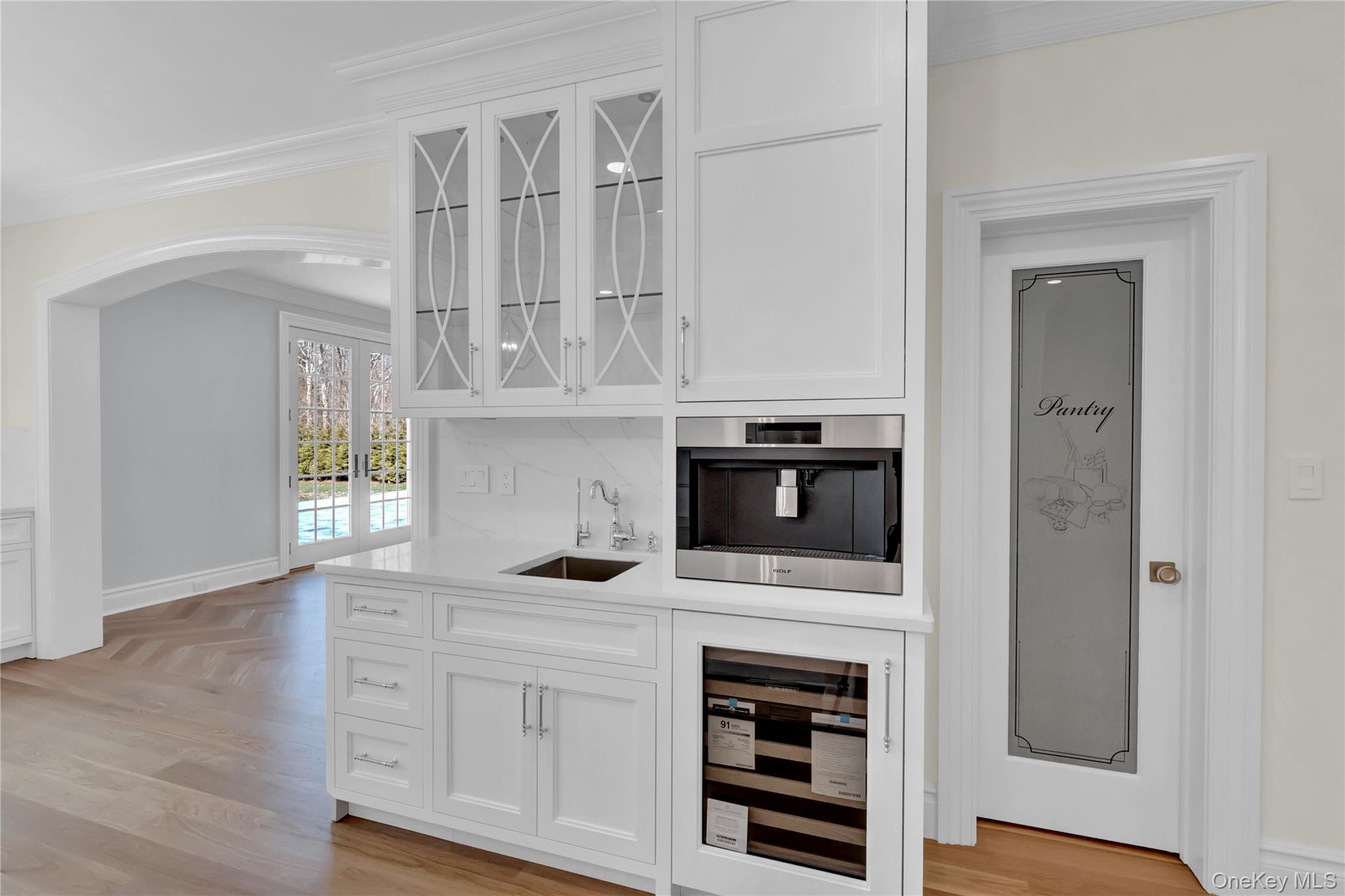 541 Split Rock Road Syosset, NY 11791 - Photo 27 of 50 a kitchen with stainless steel appliances a stove microwave and cabinets