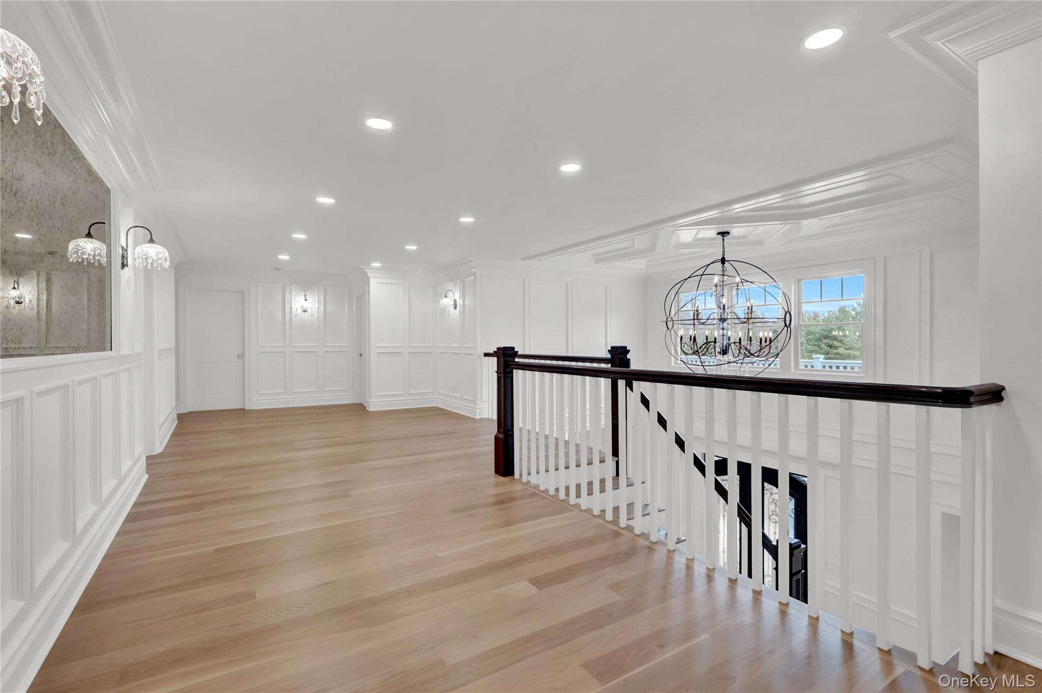 541 Split Rock Road Syosset, NY 11791 - Photo 31 of 50 a view of a hallway with wooden floor and stairs