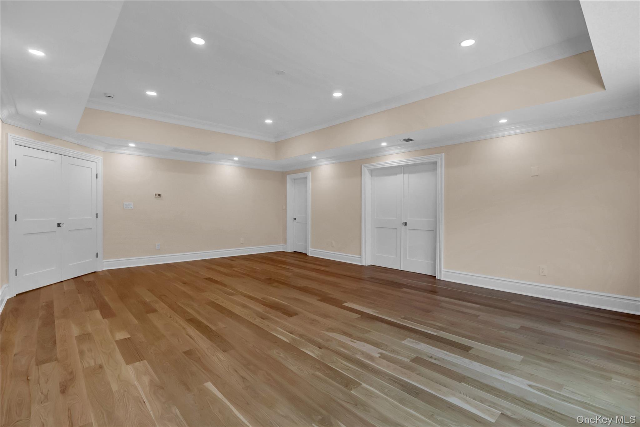 541 Split Rock Road Syosset, NY 11791 - Photo 33 of 50 a view of an empty room with wooden floor