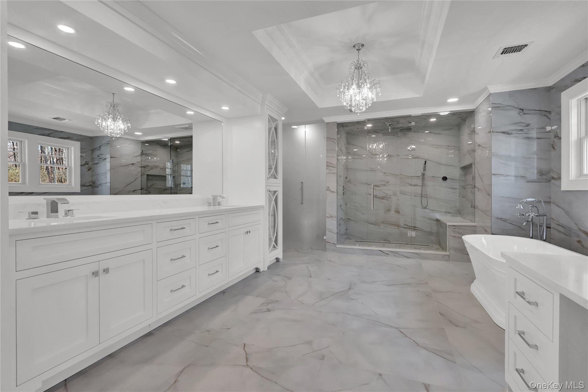 541 Split Rock Road Syosset, NY 11791 - Photo 36 of 50 a bathroom with a double vanity sink mirror and shower