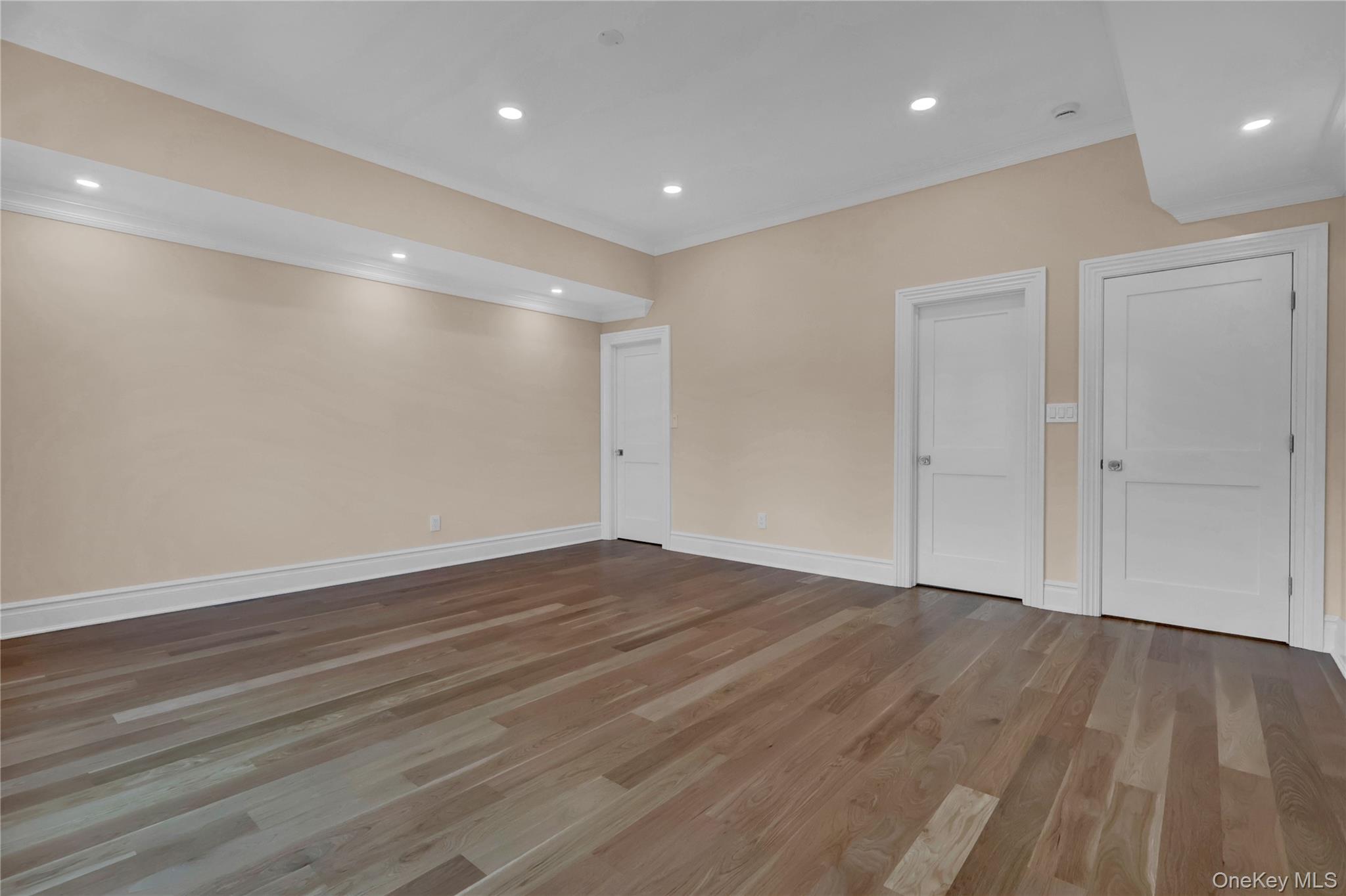 541 Split Rock Road Syosset, NY 11791 - Photo 38 of 50 a view of an empty room with wooden floor