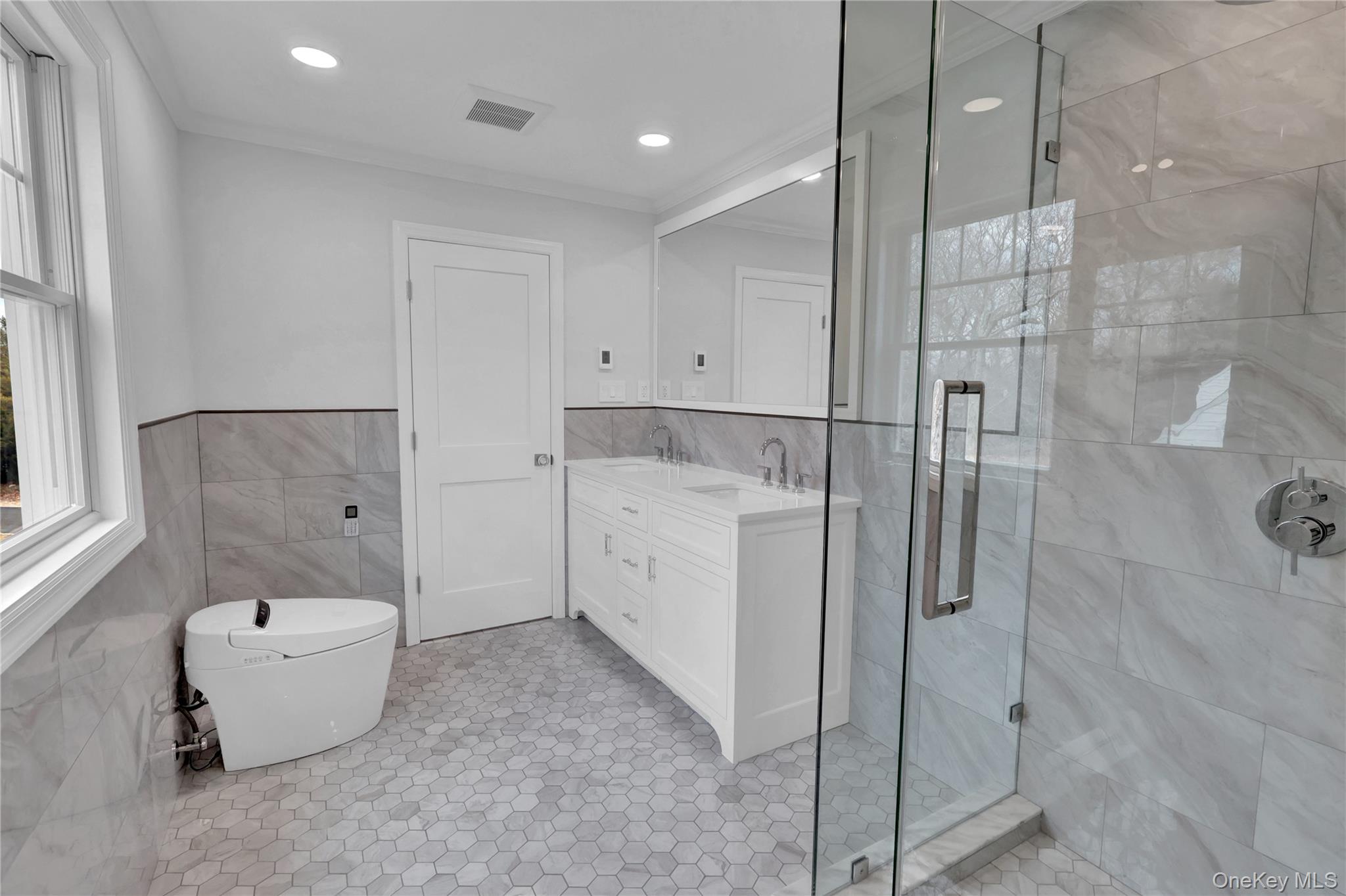 541 Split Rock Road Syosset, NY 11791 - Photo 43 of 50 a room with a walk in closet and wooden floor