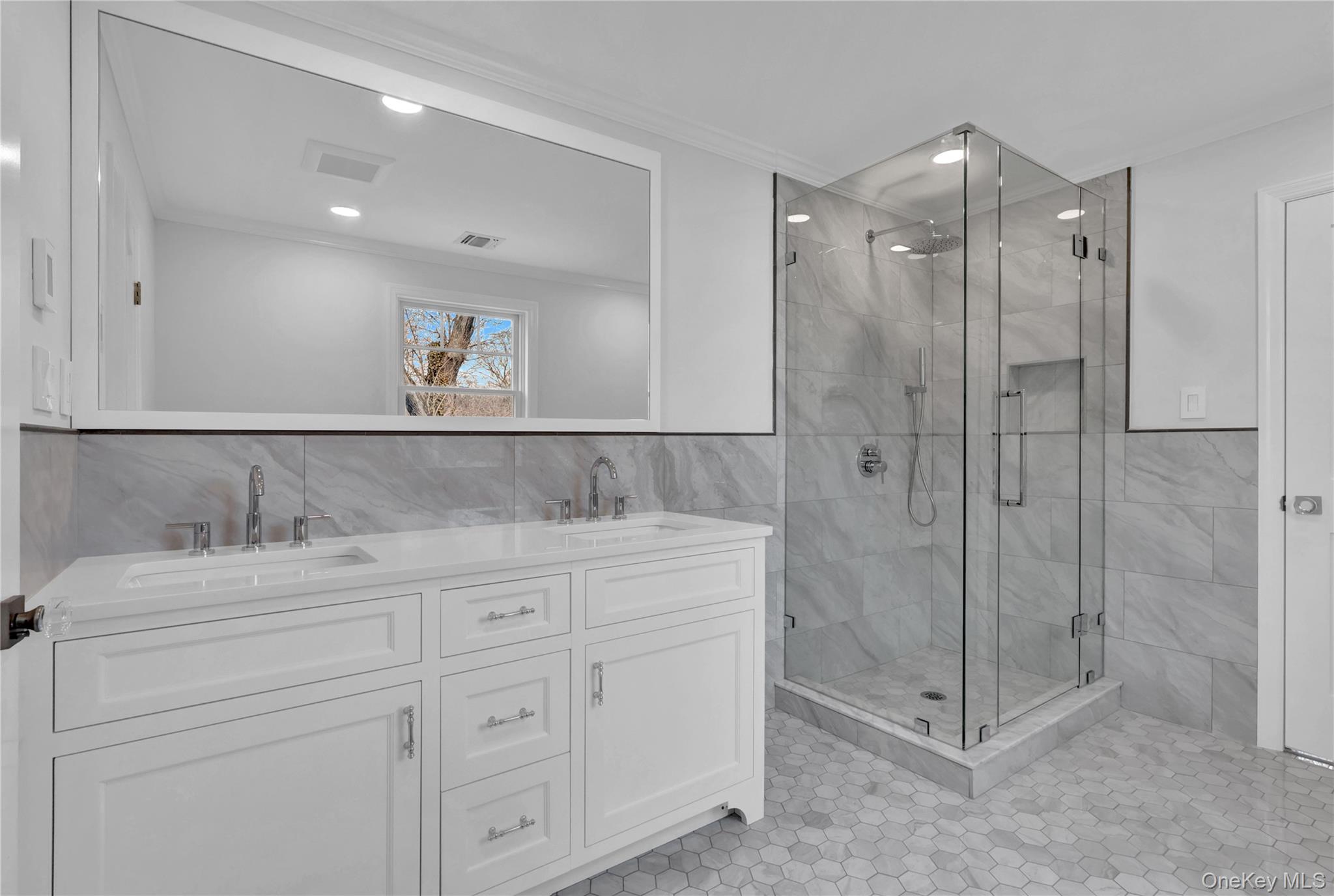 541 Split Rock Road Syosset, NY 11791 - Photo 44 of 50 a bathroom with a shower sink and mirror
