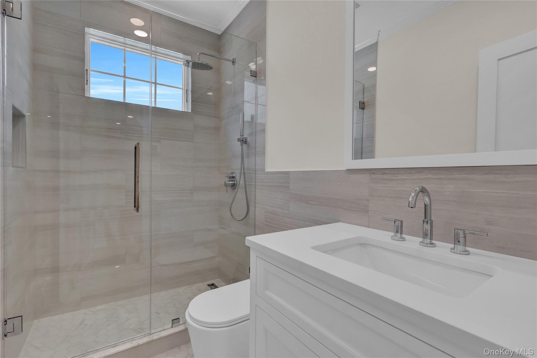 541 Split Rock Road Syosset, NY 11791 - Photo 47 of 50 a bathroom with a sink a toilet and shower