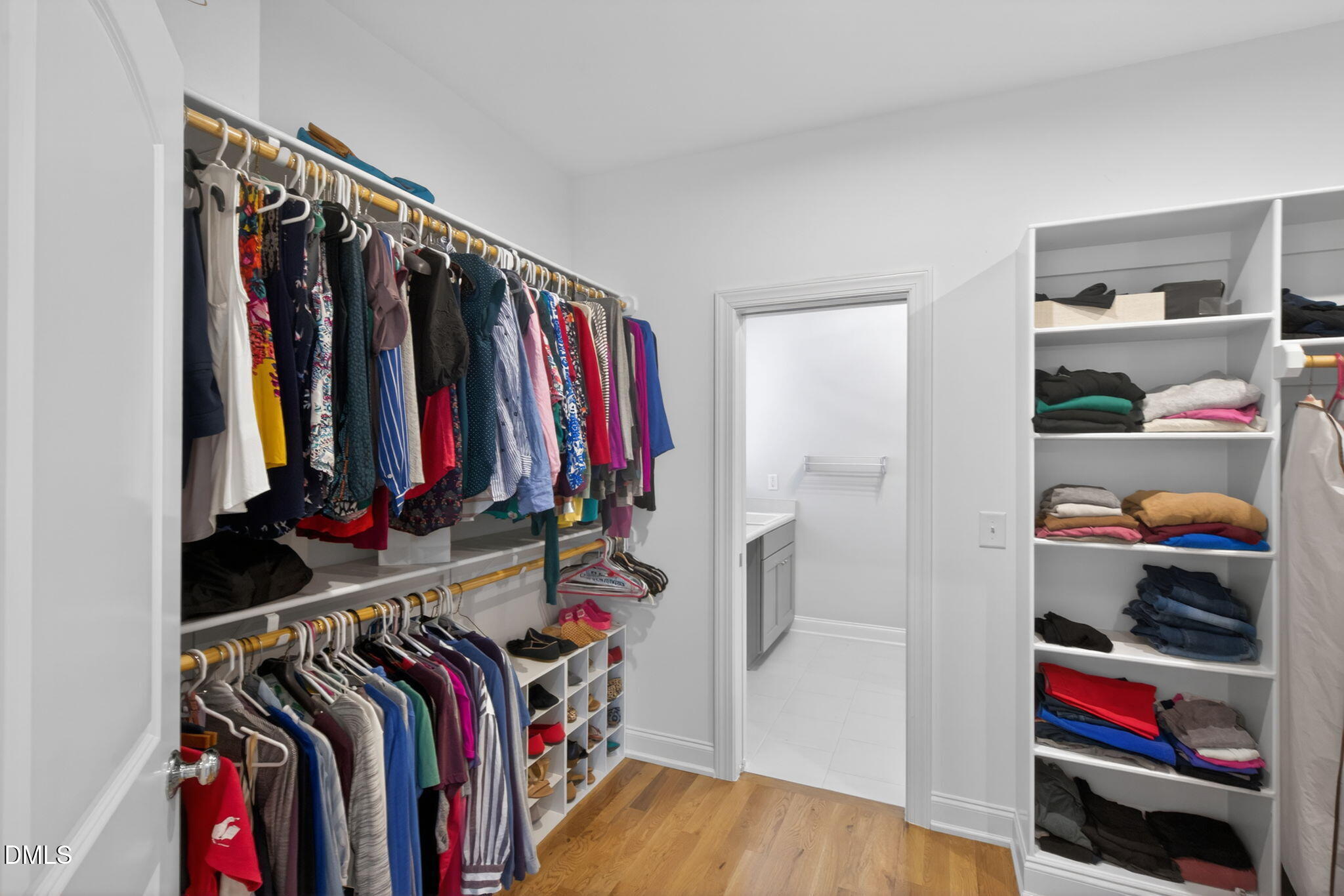 6901 Ray Family Farm Court Raleigh, NC 27613 - Photo 33 of 52 a view of walk in closet with clothes and shoes