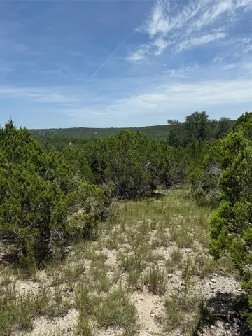 a view of a lake with a yard