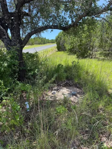 a view of a lake with a yard