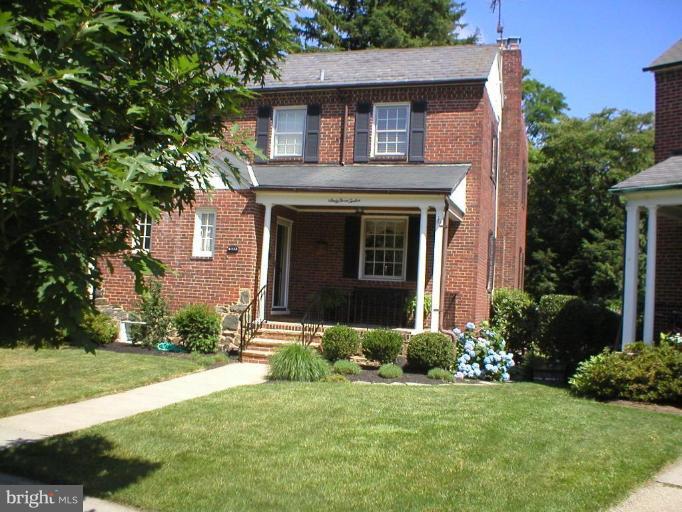 6312 Blackburn Court Baltimore, MD 21212 - Photo 1 of 13 a front view of a house with a yard and garage