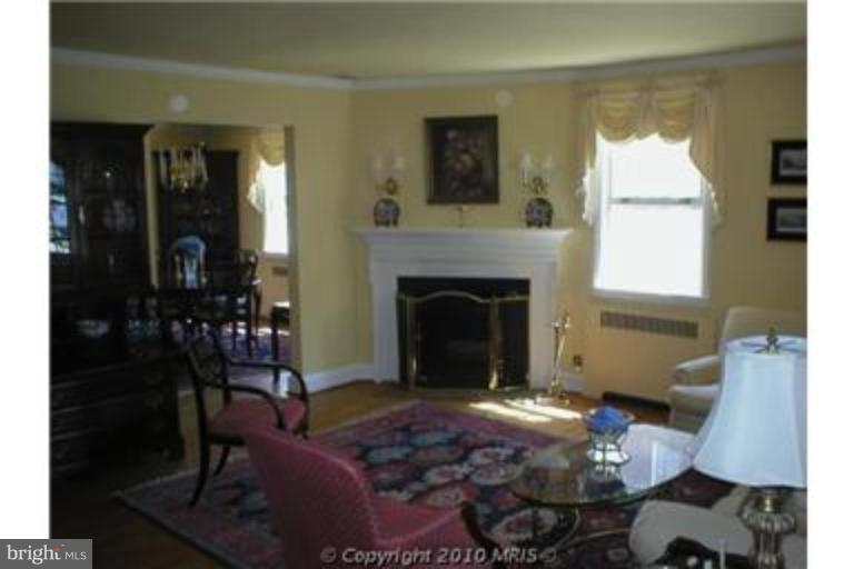 6312 Blackburn Court Baltimore, MD 21212 - Photo 2 of 13 a living room with furniture and a fireplace