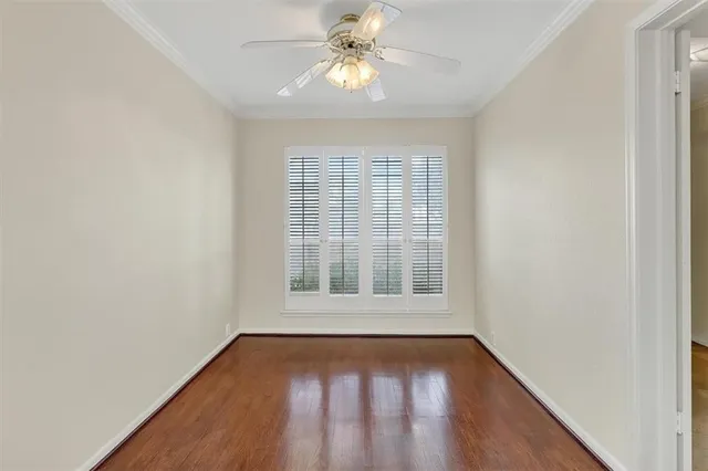 a kitchen with stainless steel appliances granite countertop a sink and cabinets with wooden floors