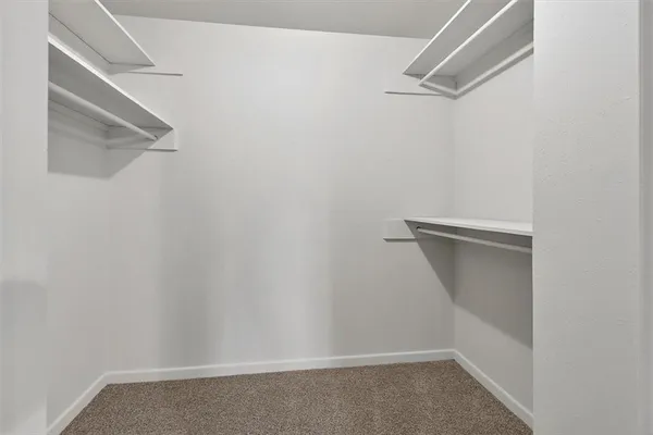 a bathroom with a double vanity sink and mirror