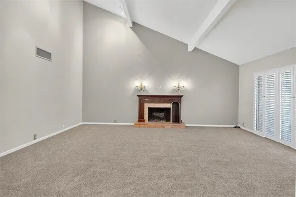 an empty room with a fireplace