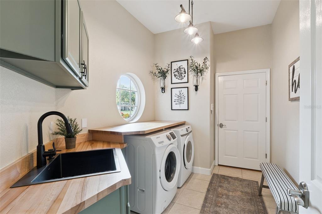 10442 Birch Tree Lane Windermere, FL 34786 - Photo 30 of 69 a kitchen with a refrigerator sink and cabinets