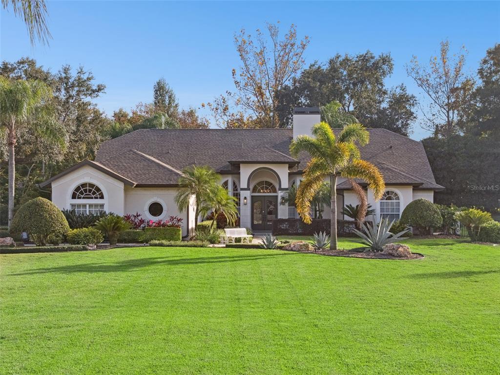 10442 Birch Tree Lane Windermere, FL 34786 - Photo 69 of 69 a house view with garden space and entertaining space