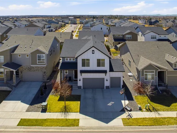 an aerial view of a house with swimming pool