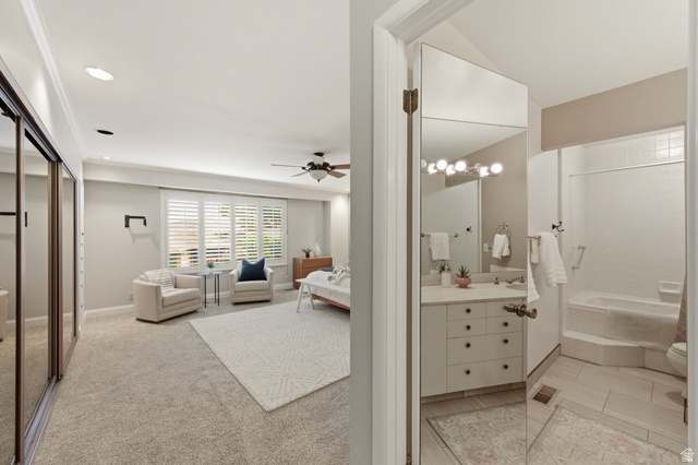 3674 Oak Rim Way Salt Lake City, UT 84109 - Photo 14 of 47 Bedroom featuring carpet flooring, crown molding, plantation shutters, and mirrored closet doors