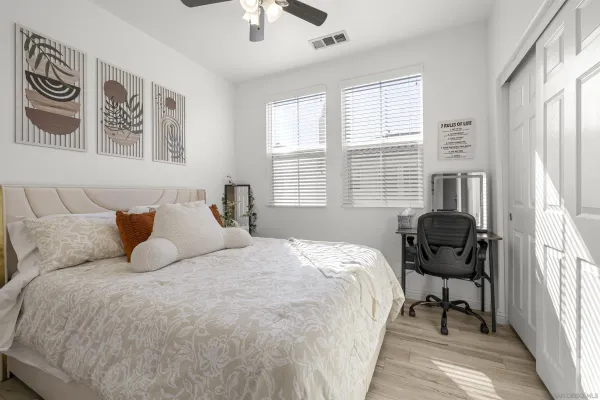 a living room with furniture and a mirror