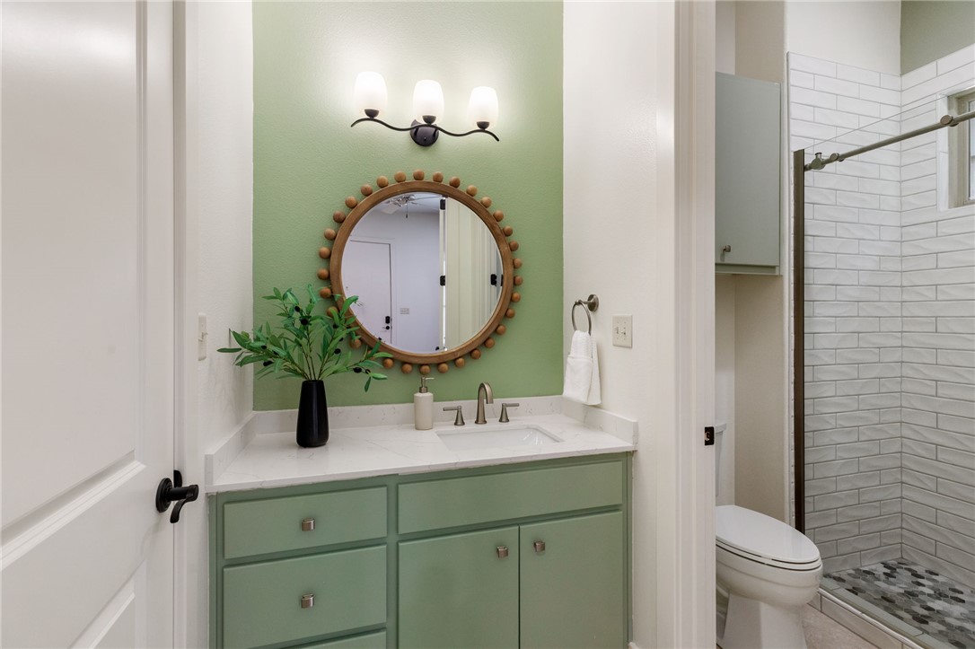 2833 Persimmon Ridge Court Bryan, TX 77807 - Photo 45 of 50 a bathroom with a sink and a mirror