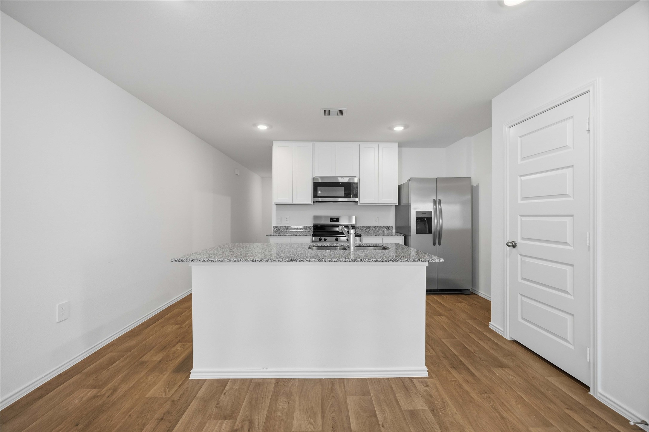 11913 Sweet Apple Lane Houston, TX 77048 - Photo 6 of 20 a view of a kitchen with wooden floor