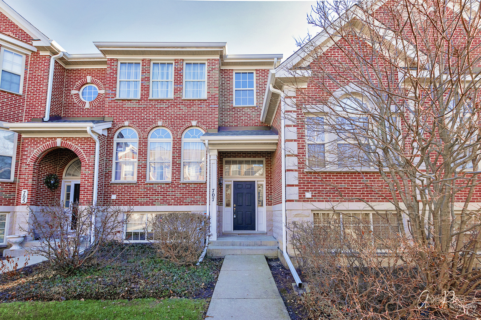 707 Prestwick Lane Wheeling, IL 60090 - Photo 1 of 29 front view of a house with a yard