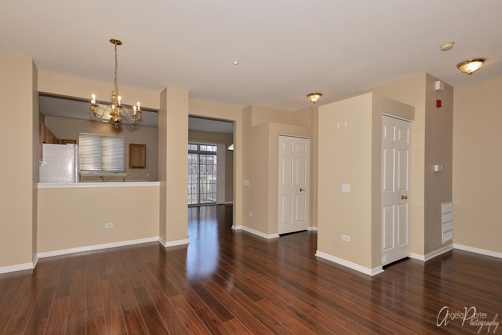 707 Prestwick Lane Wheeling, IL 60090 - Photo 11 of 29 a view of a room with wooden floor and kitchen view